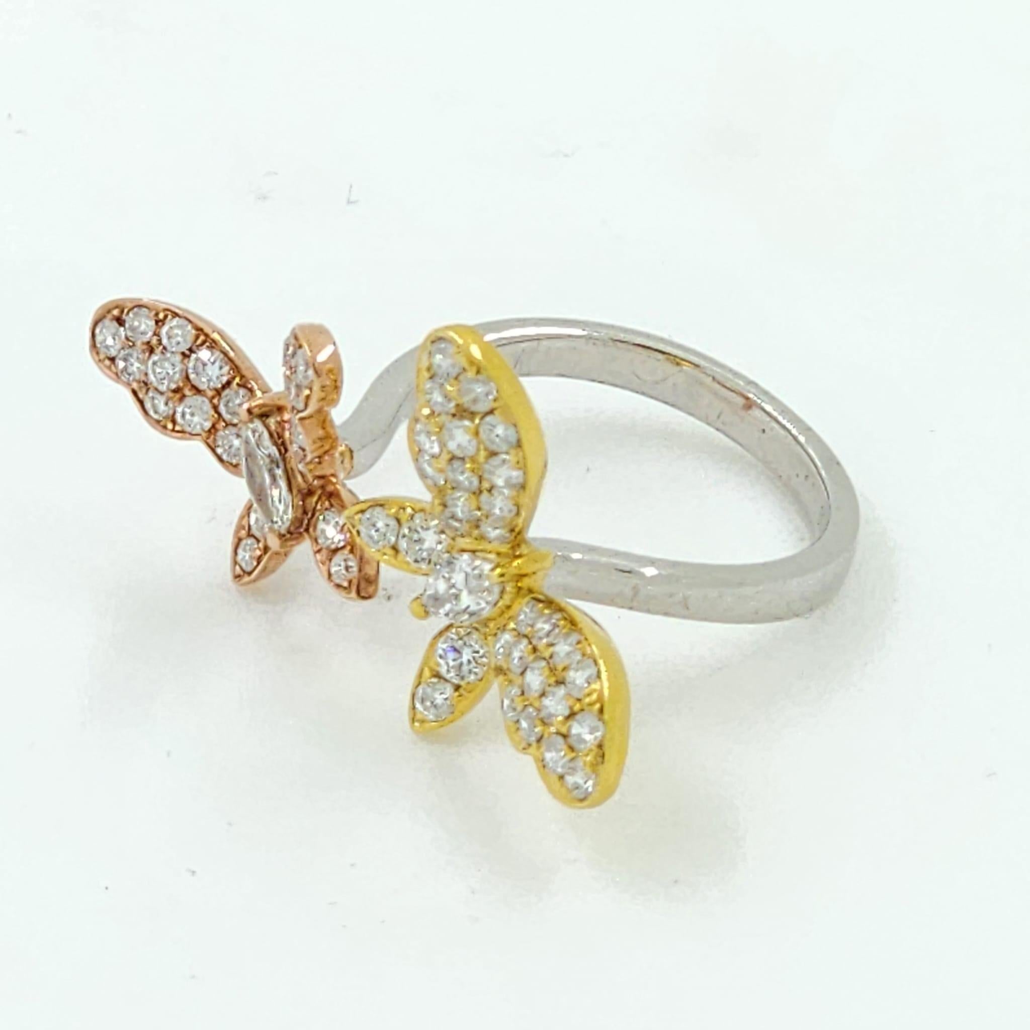 Experience the epitome of luxury and craftsmanship with our Tri-Gold Marquise Diamond Butterfly Ring. Elegantly fashioned in a harmonious blend of 18 karat rose, white, and yellow gold, this ring exudes an air of unparalleled sophistication. At its