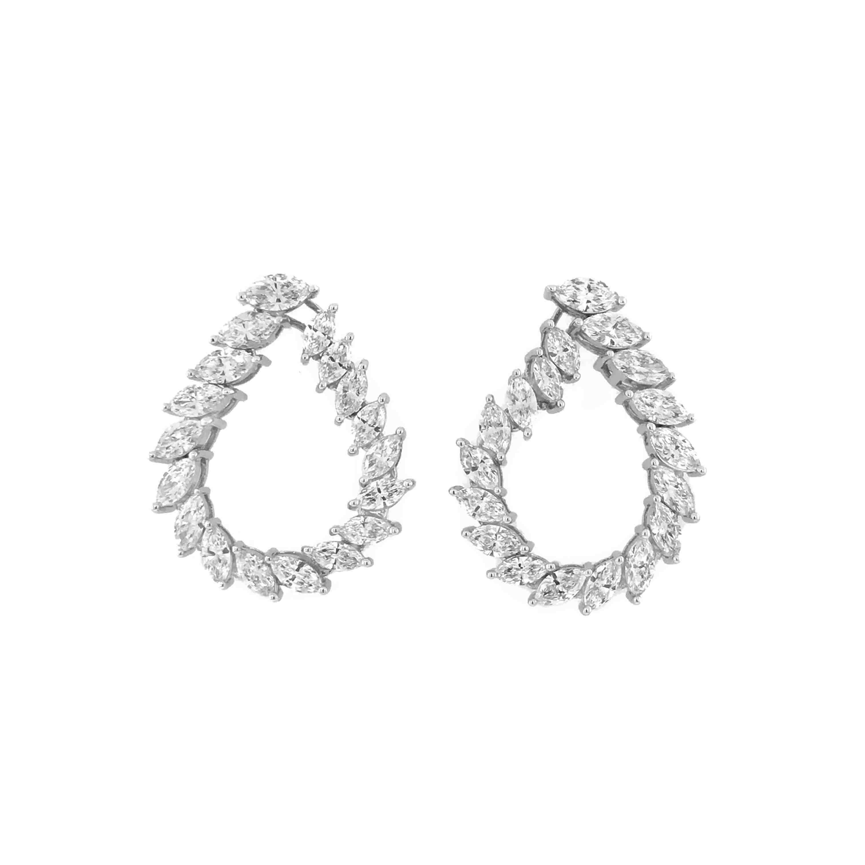 For the extravagant. Embellished with 36 sparkling marquise cut diamonds and wrapped in the sublime 18kt white gold.

The Nysa diamond earrings can be worn as hoops & also suavely convert as dangling line earrings. So you can adorn the charm of two