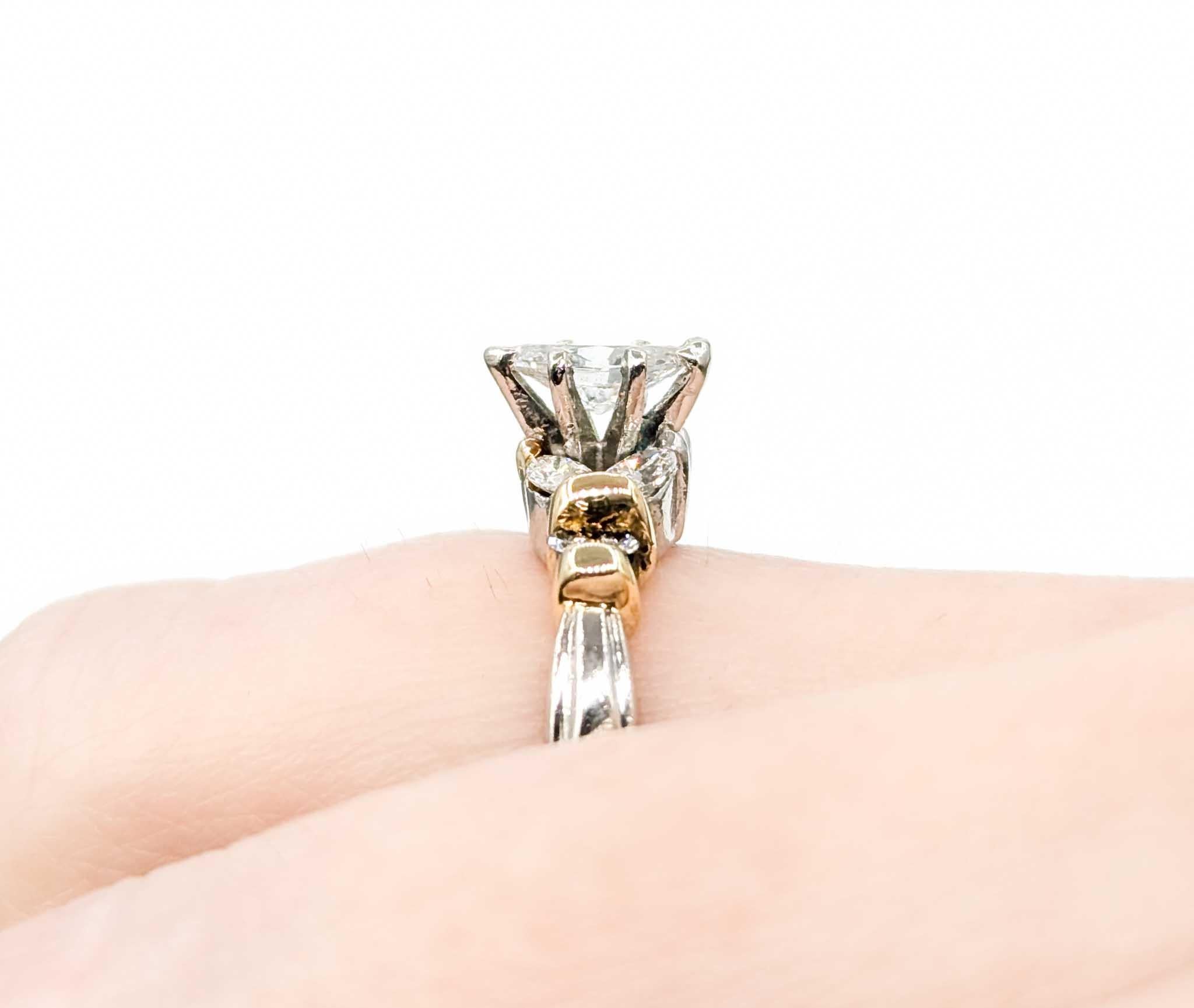 Marquise Diamond Engagement Ring in Platinum and 18k Yellow Gold

This stunning engagement ring is crafted in a combination of platinum and 18k yellow gold and features a 0.40ct diamond centerpiece, the birthstone for April. The diamond is