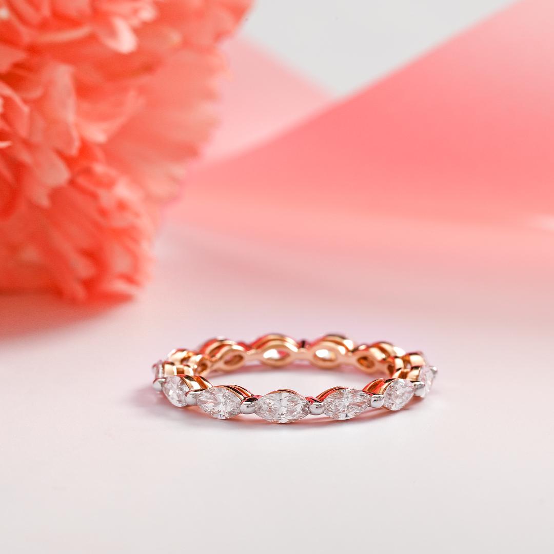 Dainty but mighty. Set in 14KT rose gold, the Marquise Eternity band is nothing short of charisma. Embellished with marquise cut diamonds.

IGI CERTIFIED

Gold- 1.25 gms
Diamond- 1.20 carats
Diamond Colour: I-J
Diamond Clarity: SI
Ring Weight: 1.50