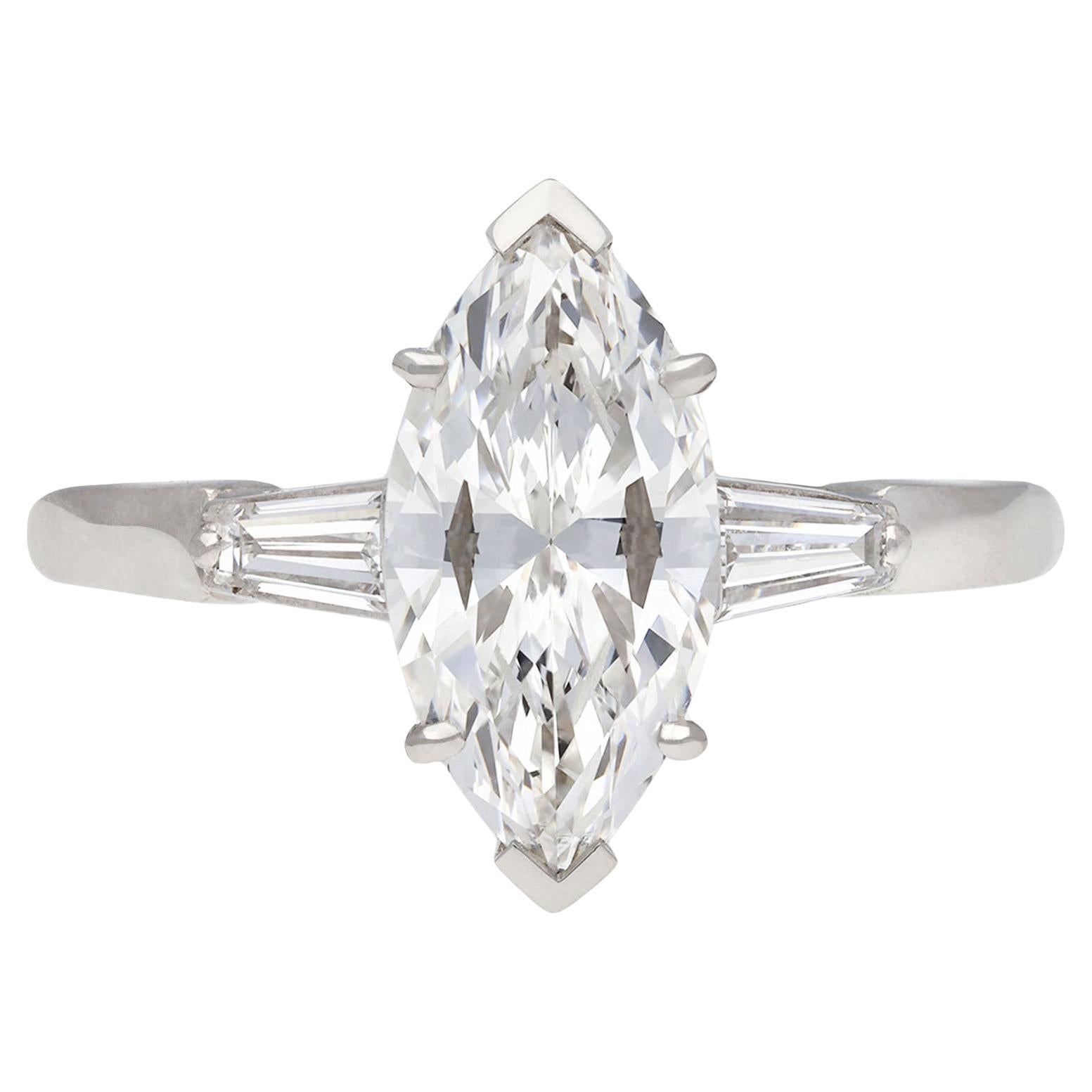Marquise diamond flanked solitaire ring, circa 1950. For Sale
