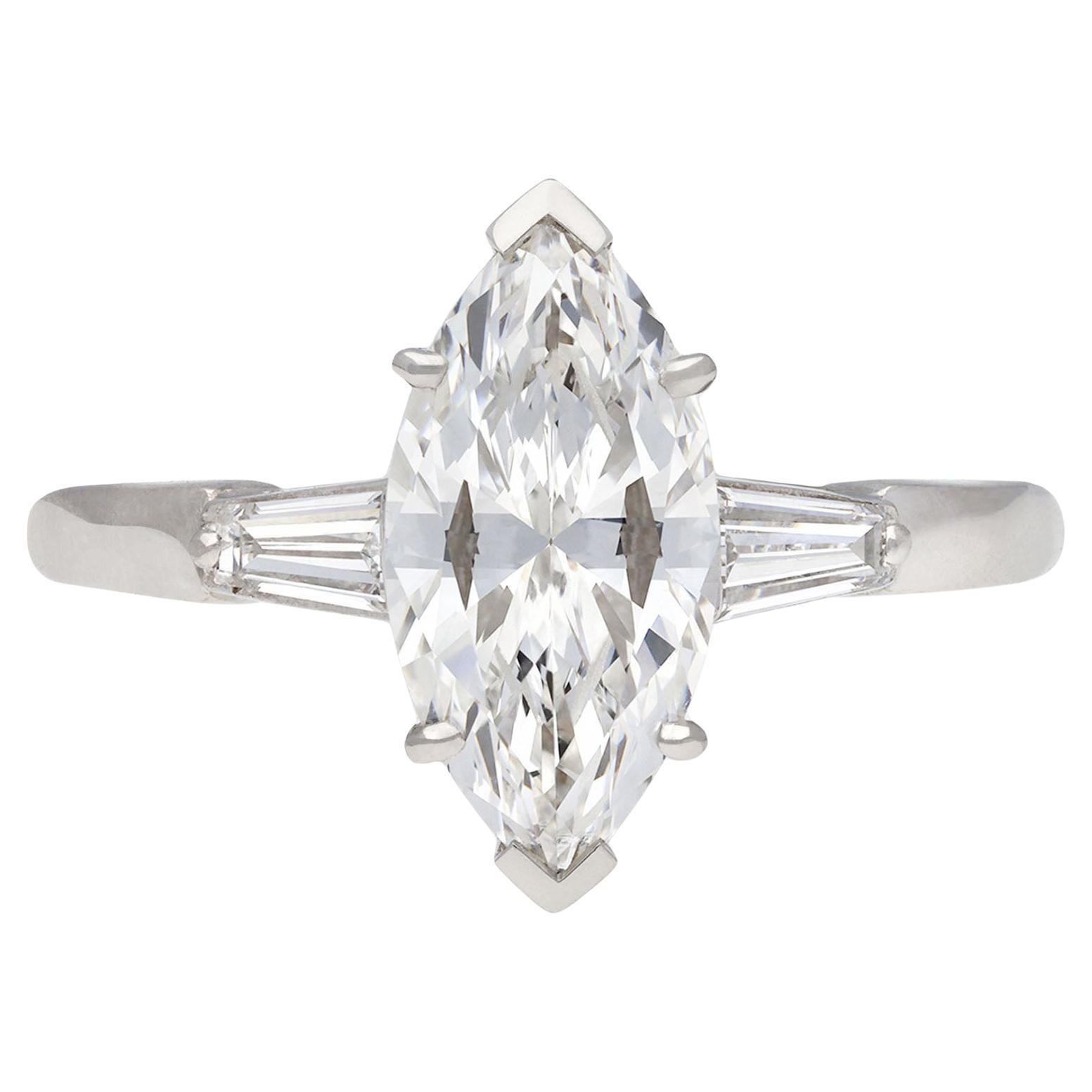 Marquise diamond flanked solitaire ring, circa 1950.