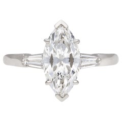 Retro Marquise diamond flanked solitaire ring, circa 1950.