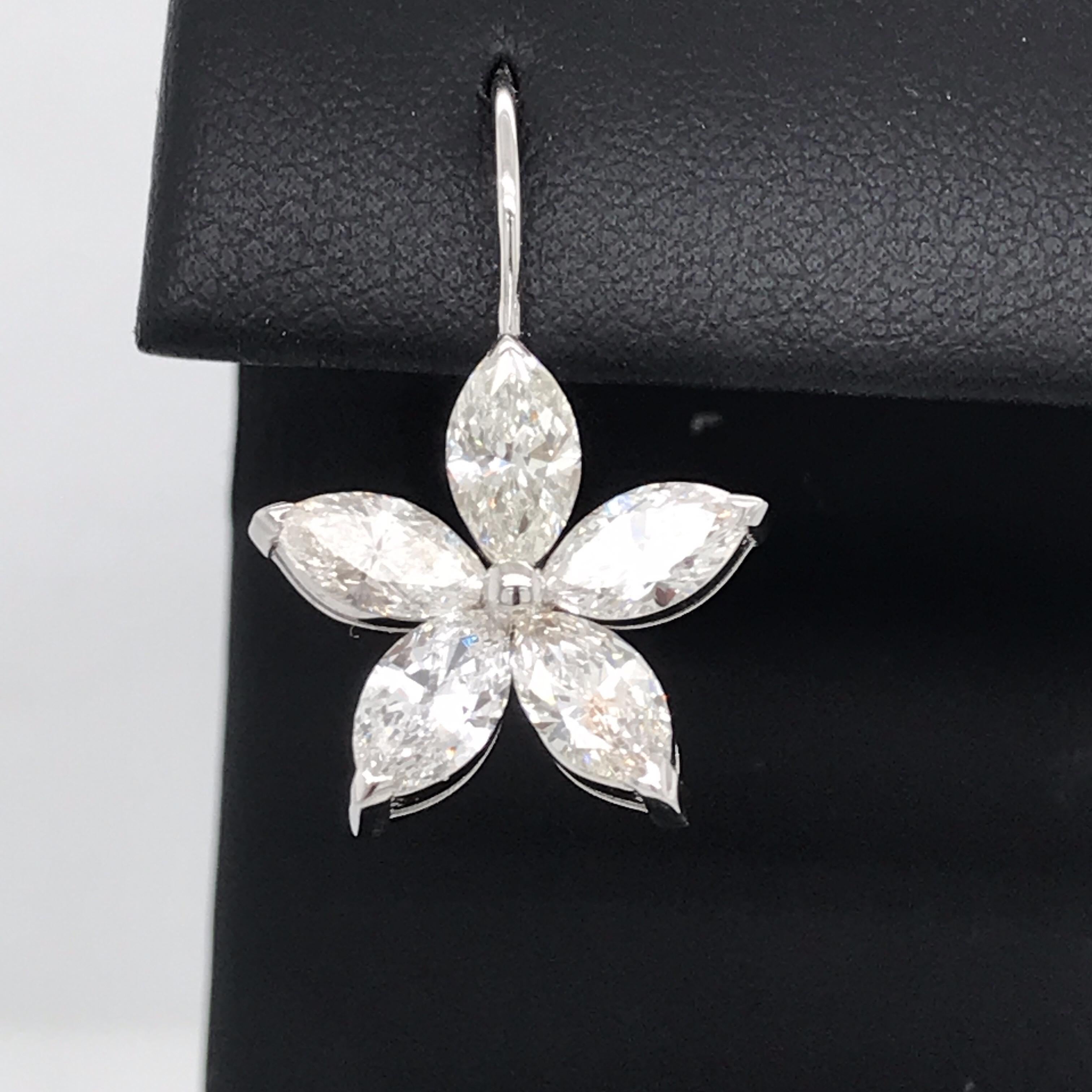 Classic 14K White gold drop earrings featuring 10 marquise cut diamonds weighing 5 carats. 
Color G-H
Clarity VS