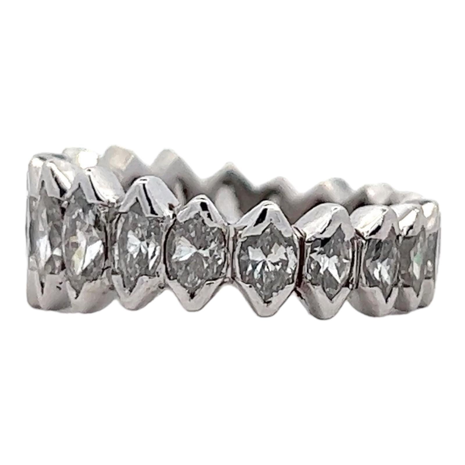 Vintage diamond eternity wedding band handcrafted in platinum. The ring features 20 marquise cut diamonds weighing approximately 2.00 carat total weight. The diamonds are graded H-I color and VS2 clarity. The ring is size 5 and graduates from