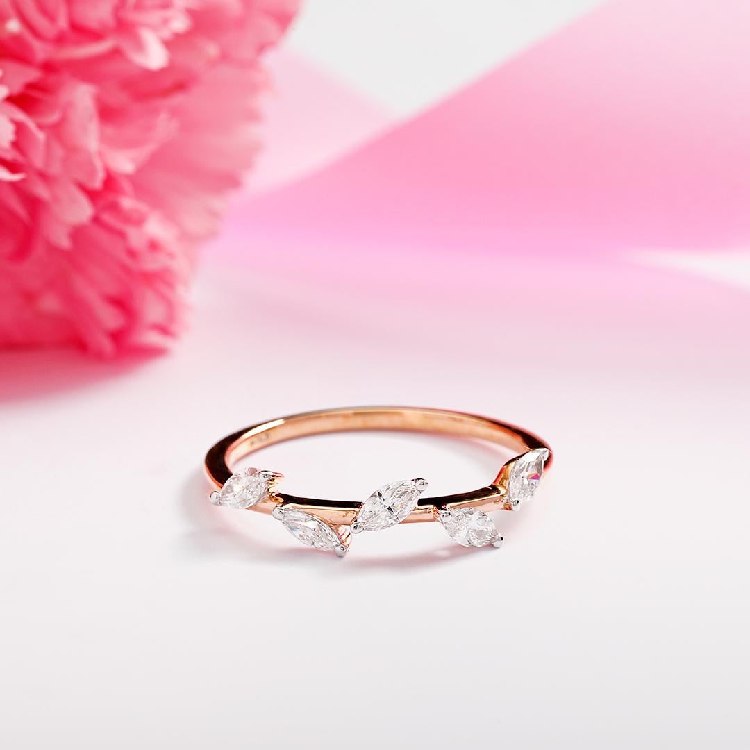 Set in smooth 14KT Rose Gold and decorated with marquise cut diamonds.

With the charm of a natural motif, the Ivy diamond ring is your timeless classic.

IGI CERTIFIED

Gold- 1.10 gms
Diamond- 0.40 carats
Diamond Colour: I-J
Diamond Clarity: