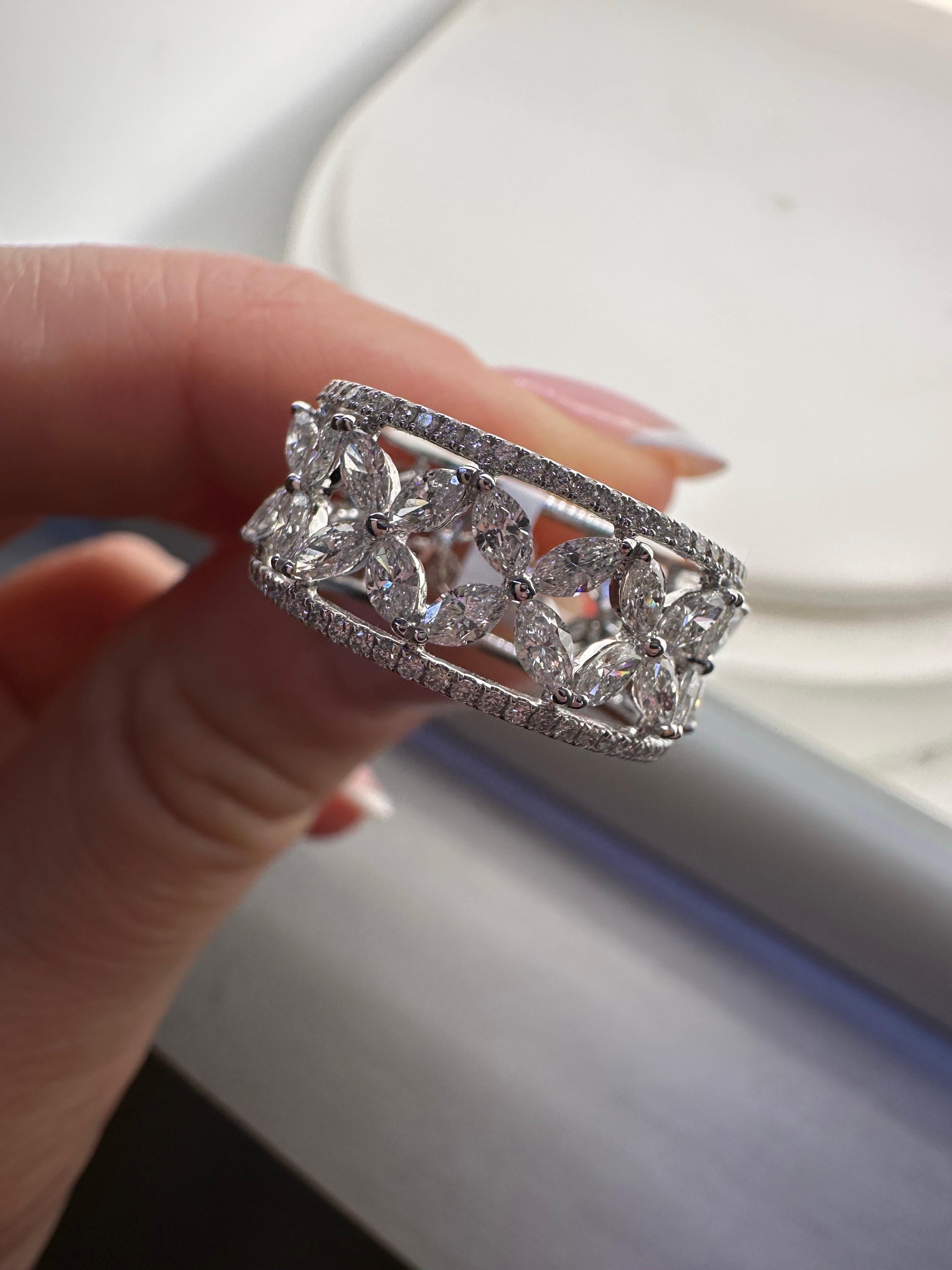 Fashion ring with natural diamonds marquise and round brilliants with VS clarity and F color totaling 2.50 carats, ring is size 5.5 and can be re-sized. The ring is made in 18KT white gold.

**All items leave our premises with a certificate in