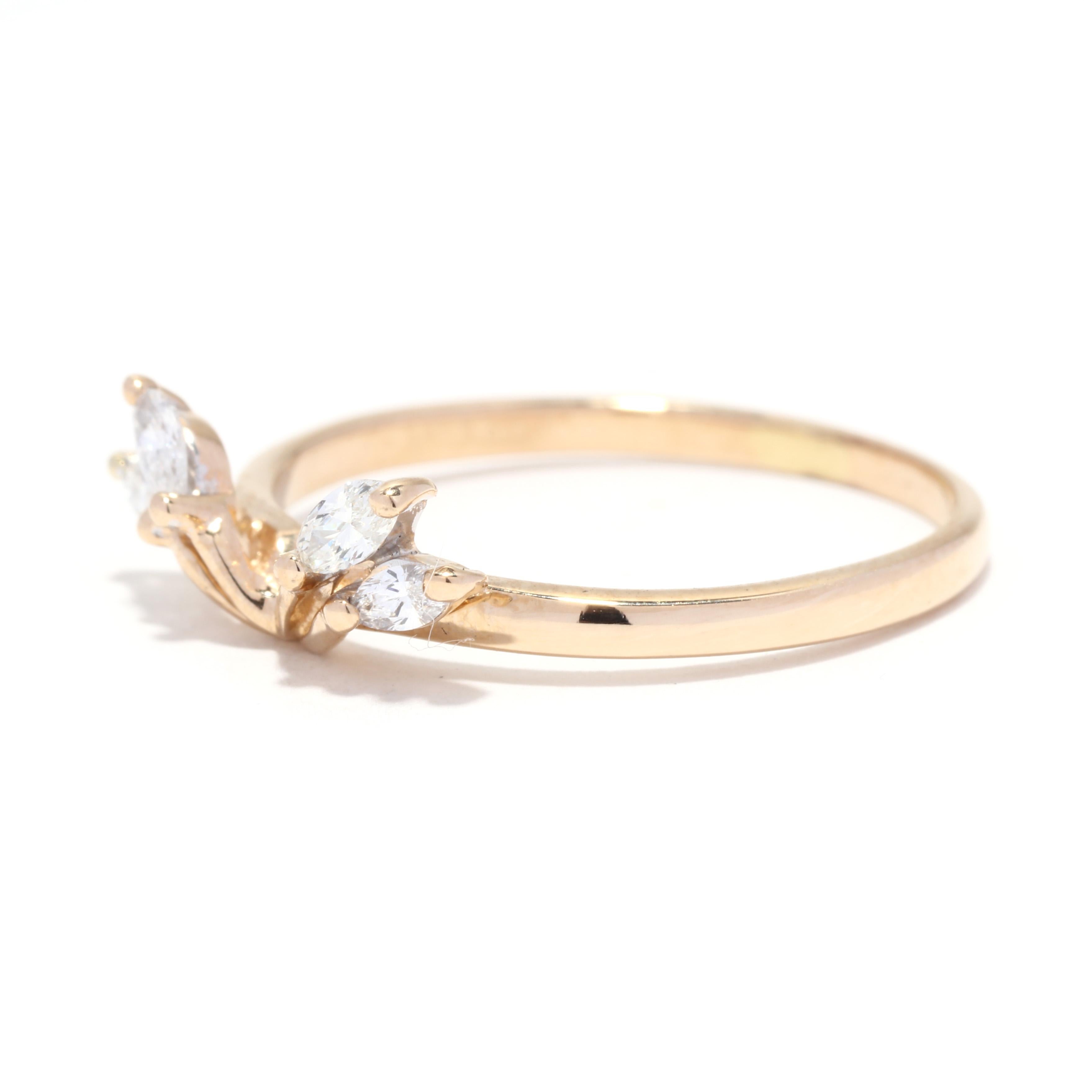 A vintage 14 karat yellow gold marquise diamond ring guard. This wrap stackable wedding band features a curved design that wraps around a solitaire set with four marquise cut diamonds weighing approximately .25 total carats and with a straight