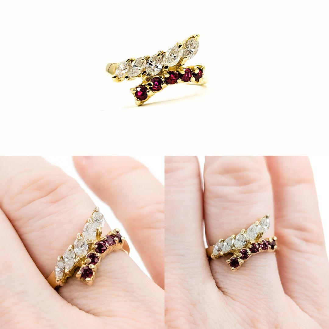 

This beautiful ring is crafted in 14k yellow gold and features a stunning 0.75 ctw marquise diamond alongside 0.25 ctw round rubies. The sparkly diamonds are SI2 clarity and G-H color, delivering both brilliance and elegance. Diamonds, as the