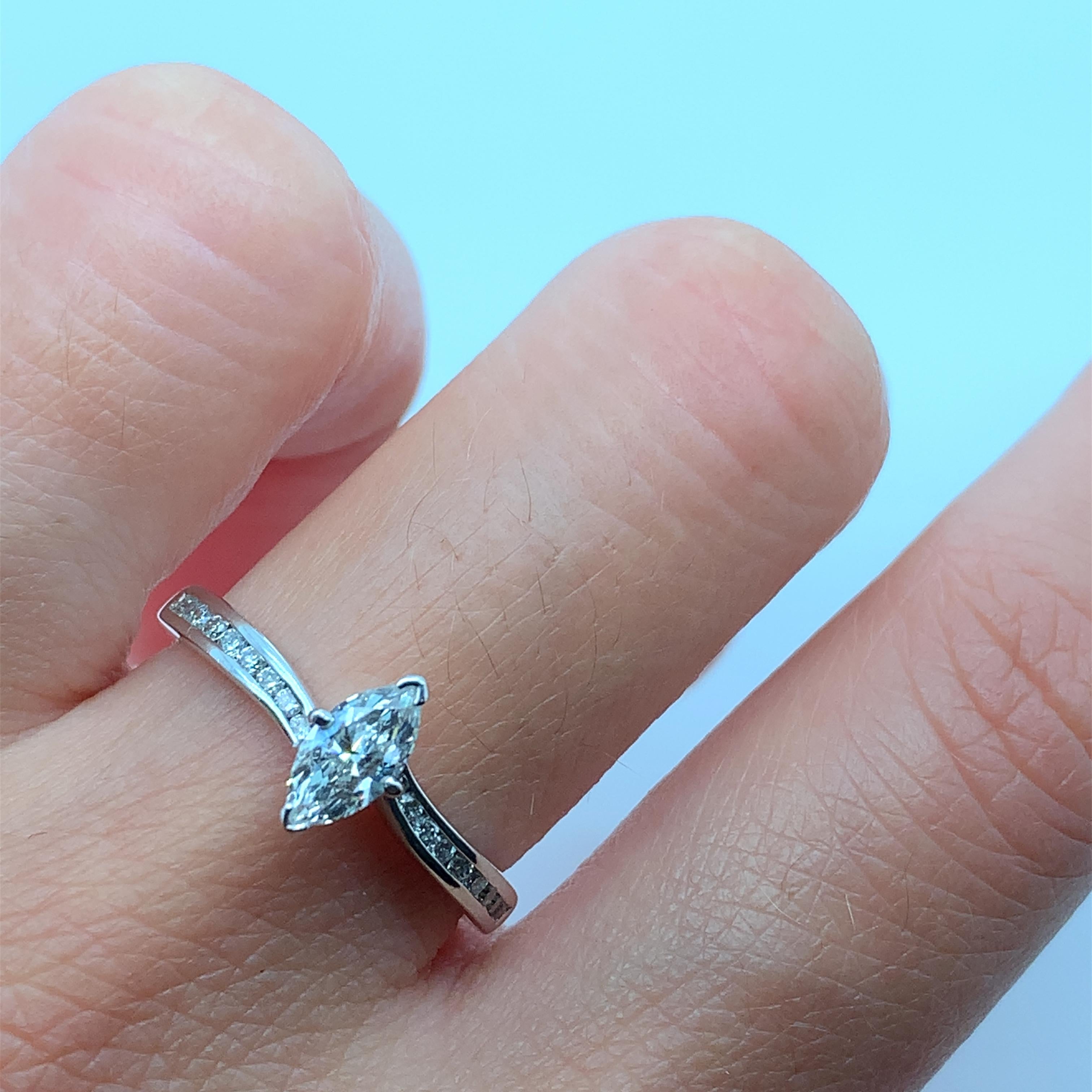 
0.65ct Marquise Diamond Engagement Ring With Diamond Band In 18k Gold.

Large marquise diamond solitaire ring.

Total diamond weight 0.65ct

Centre diamond 0.40ct

Additional diamonds 0.25ct

Hallmarked and handcrafted in London 

The ring can be