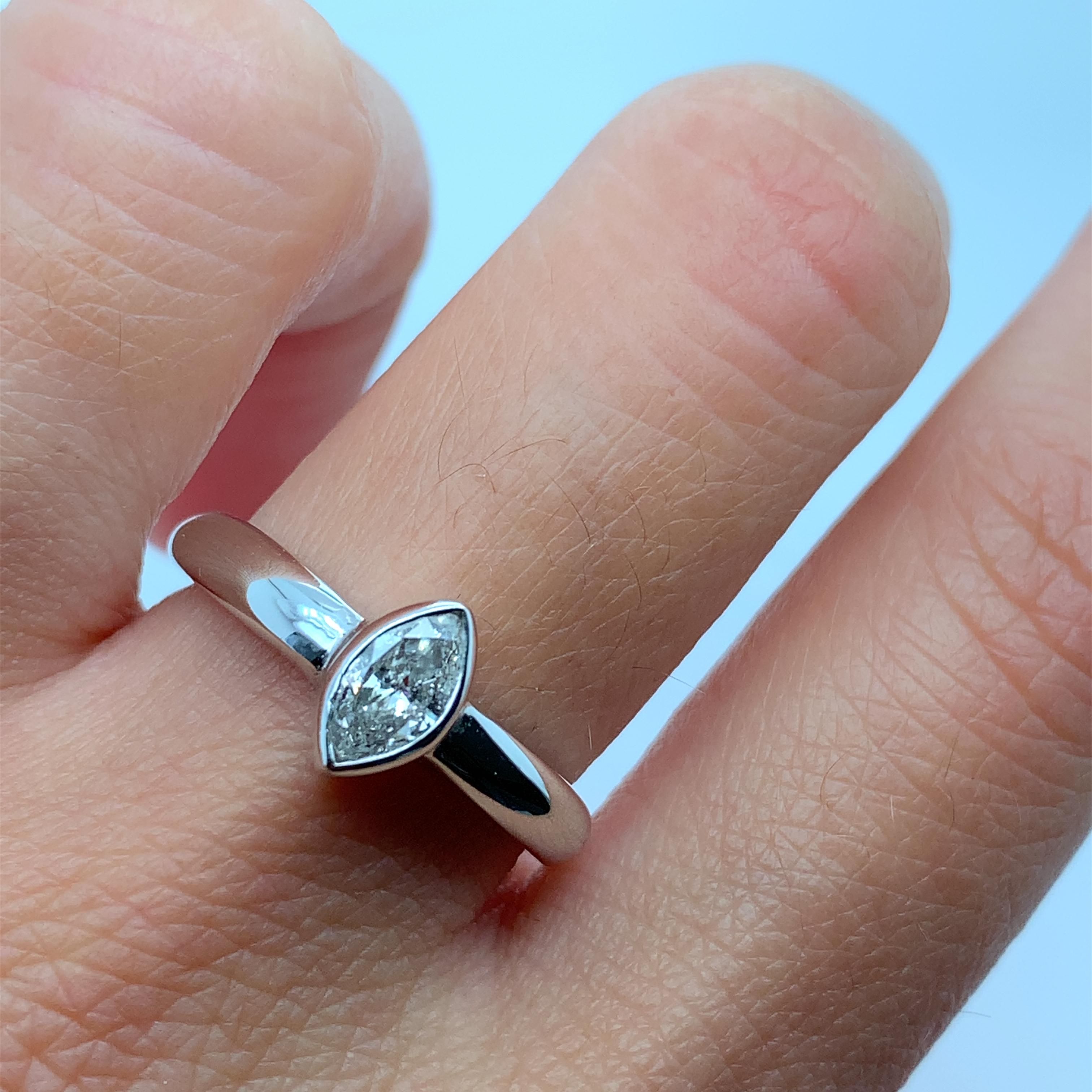 
0.65ct Marquise diamond solitaire engagement ring in 18ct white gold.

Large marquise diamond solitaire engagement ring in white gold.

Diamonds G colour VS1 clarity.

The ring can be resized.

Hallmarked

Band width top 3mm at the bottom