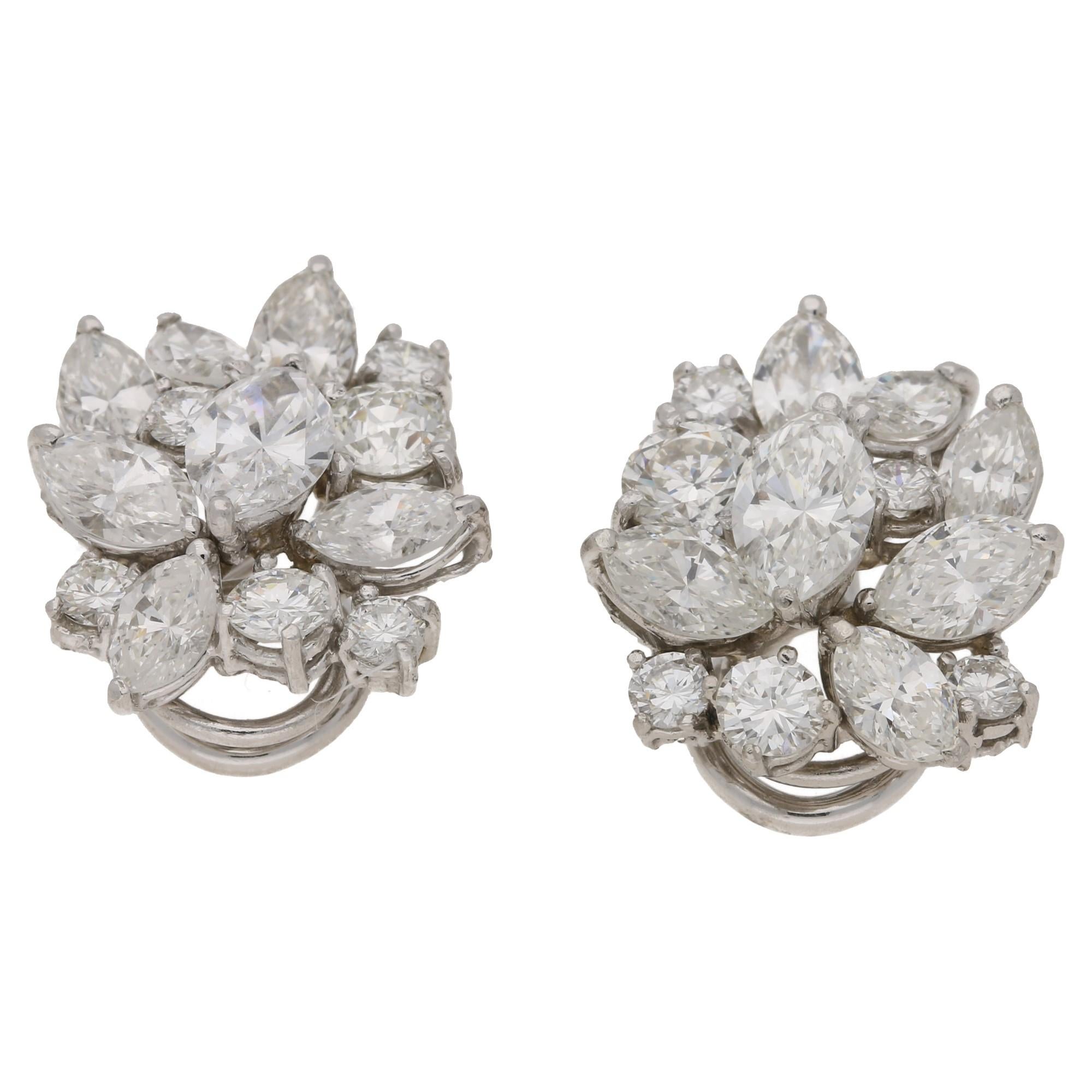 A coveted and iconic pair of floral cluster diamond earrings, featuring marquise brilliant-cut, old European brilliant-cut, transition-cut, and round brilliant-cut diamonds. This symphony of diamonds result in a cluster with remarkable brilliance,