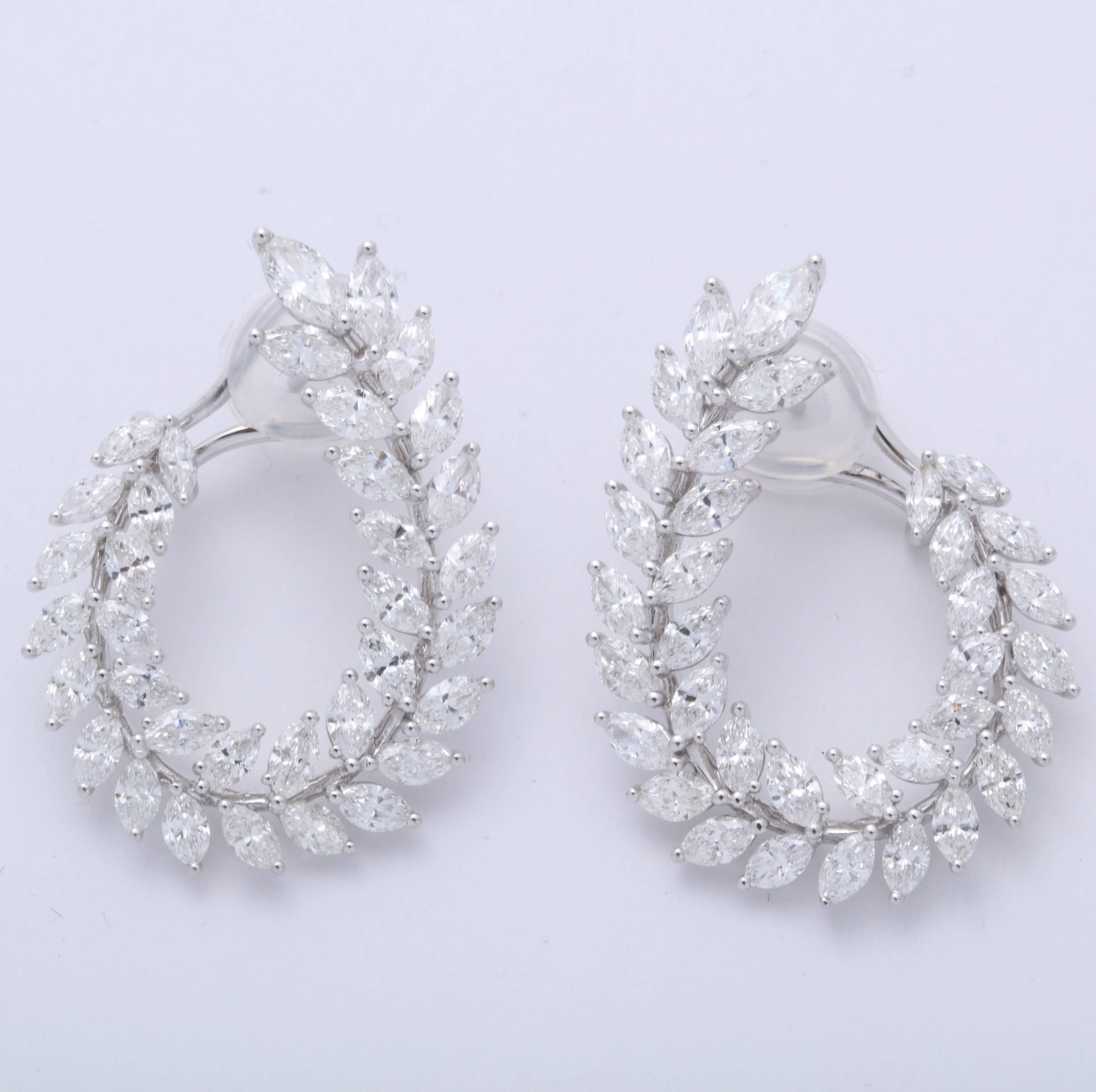 
A gorgeous pair of diamond earrings.

6.97 carats of marquise cut diamonds 

18k white gold

Approximately 1.25 inches long, just under an inch at its widest point. 

A must have -- pictures do not do these earrings justice. 

An impeccable design,