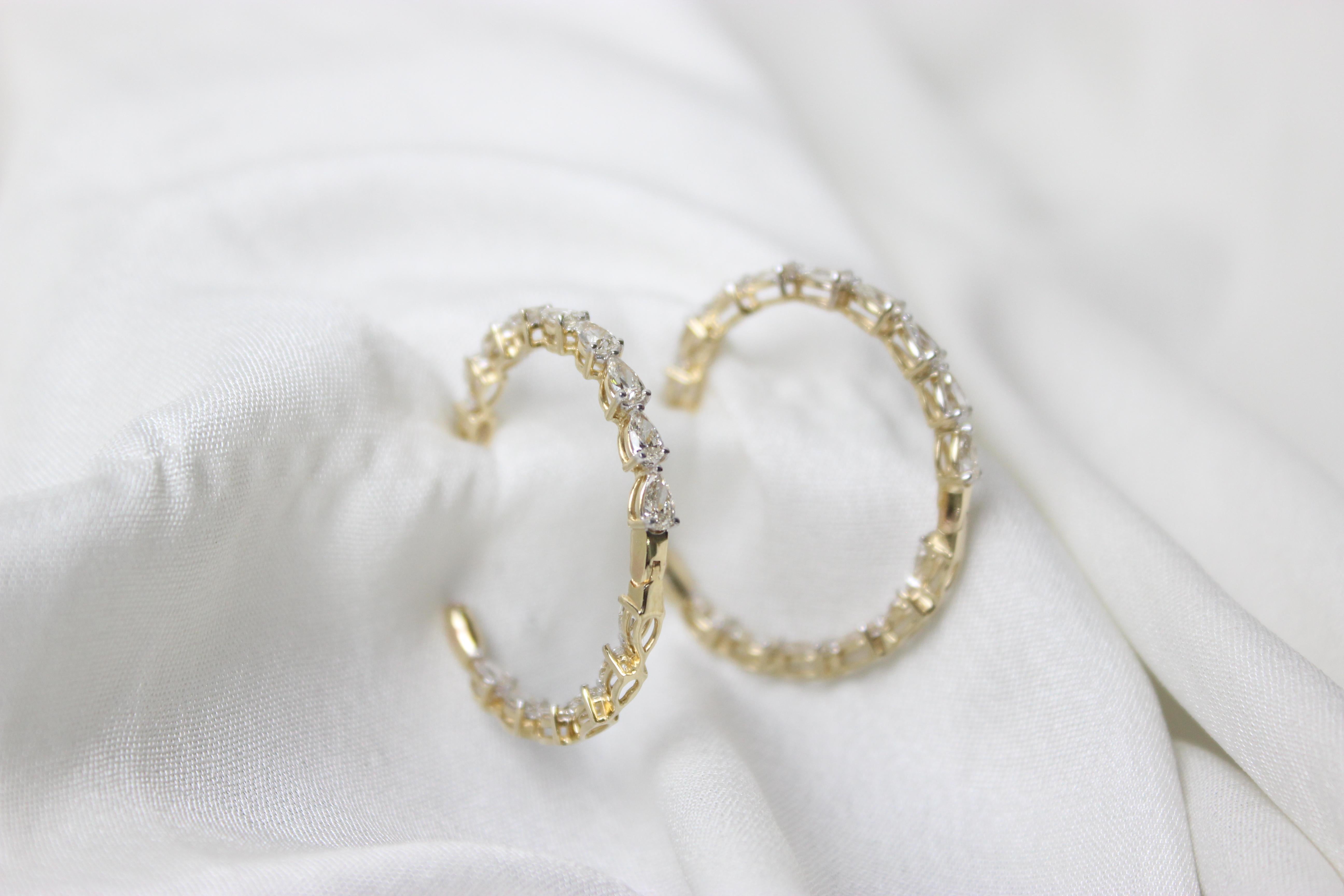 Indulge in timeless elegance with our Marquise Diamonds Hoop Earrings crafted in exquisite 18K solid gold. The elongated marquise diamonds gracefully adorn the hoops, creating a sophisticated and eye-catching design. The brilliance of the diamonds