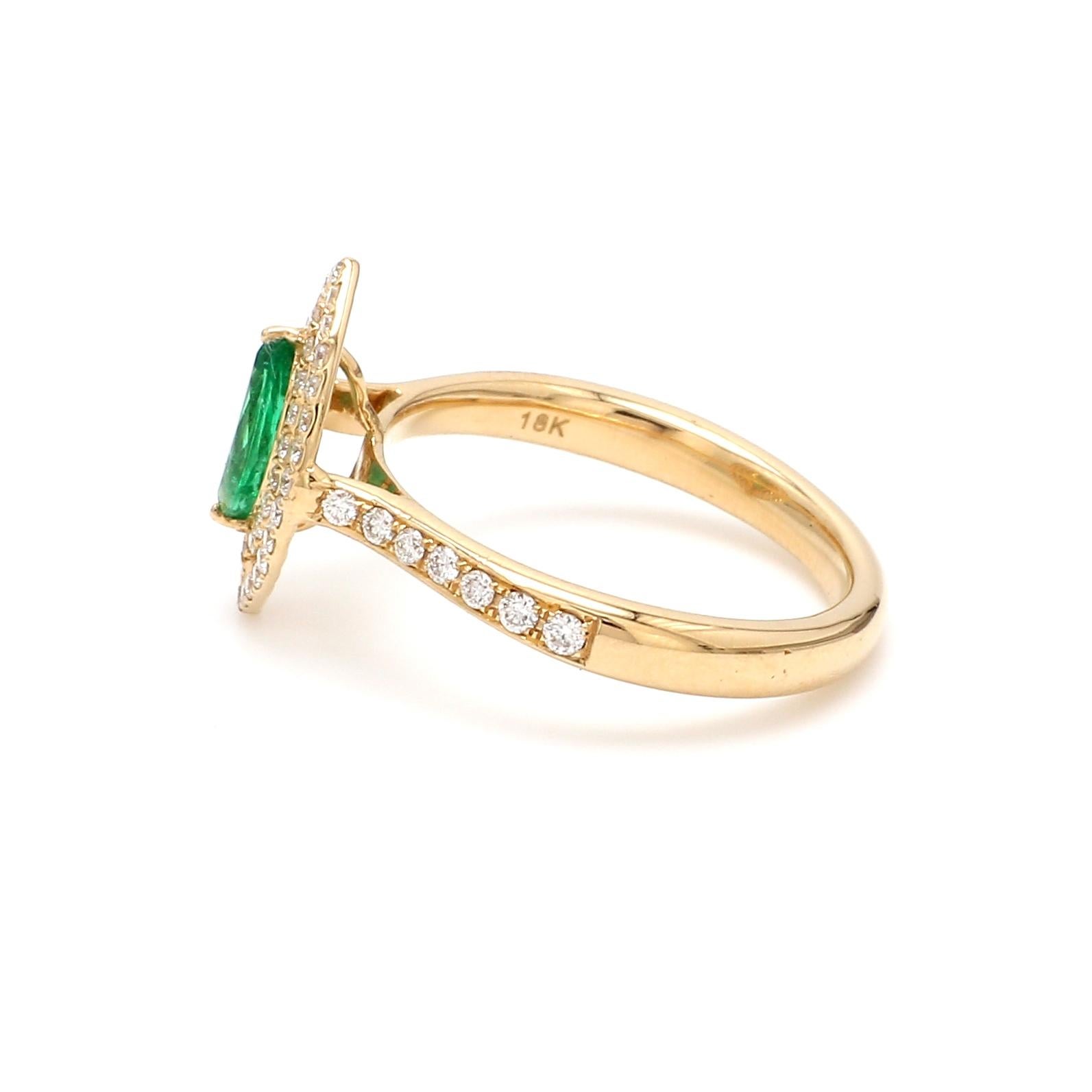 A Beautiful Handcrafted Ring in 18 Karat Yellow Gold  with Natural Emerald in Marquise Cut and Diamonds double Halo & Shank. A perfect Ring for occasion

 Emerald Details
Pieces : 1 Pieces Square Cut 
Weight : 0.38 Carat 
AAA Quality