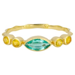 Marquise emerald ring in 14k gold