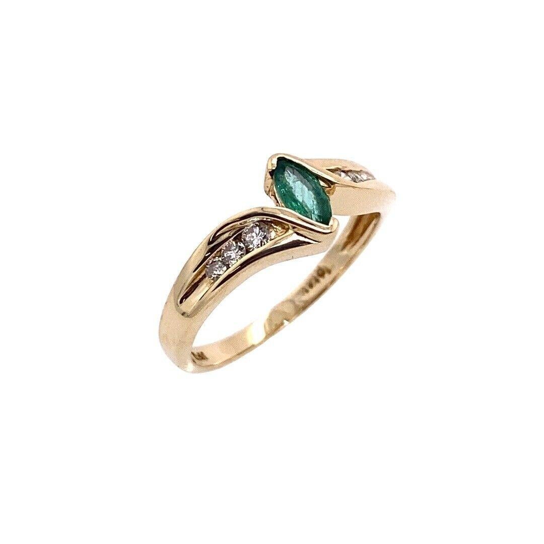 Marquise Emerald Ring, Set In 14ct Yellow Gold, With 3-Diamonds On Each Shoulder

This beautiful emerald marquise shape ring is set in a 14ct yellow gold band. The diamonds on each shoulder add to the overall appeal of this setting. (Not hallmarked,