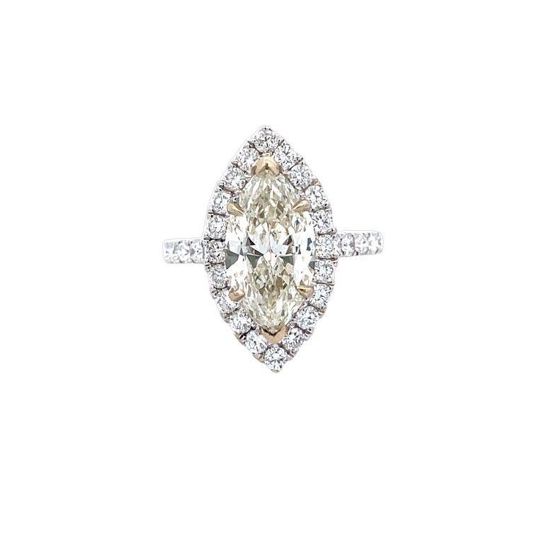 Are you looking for a ring that symbolizes your love and commitment? Look no further than this stunning piece of jewelry! It boasts a beautiful centerpiece featuring a white marquise diamond weighing a substantial 3.00 carats, this marquise diamond