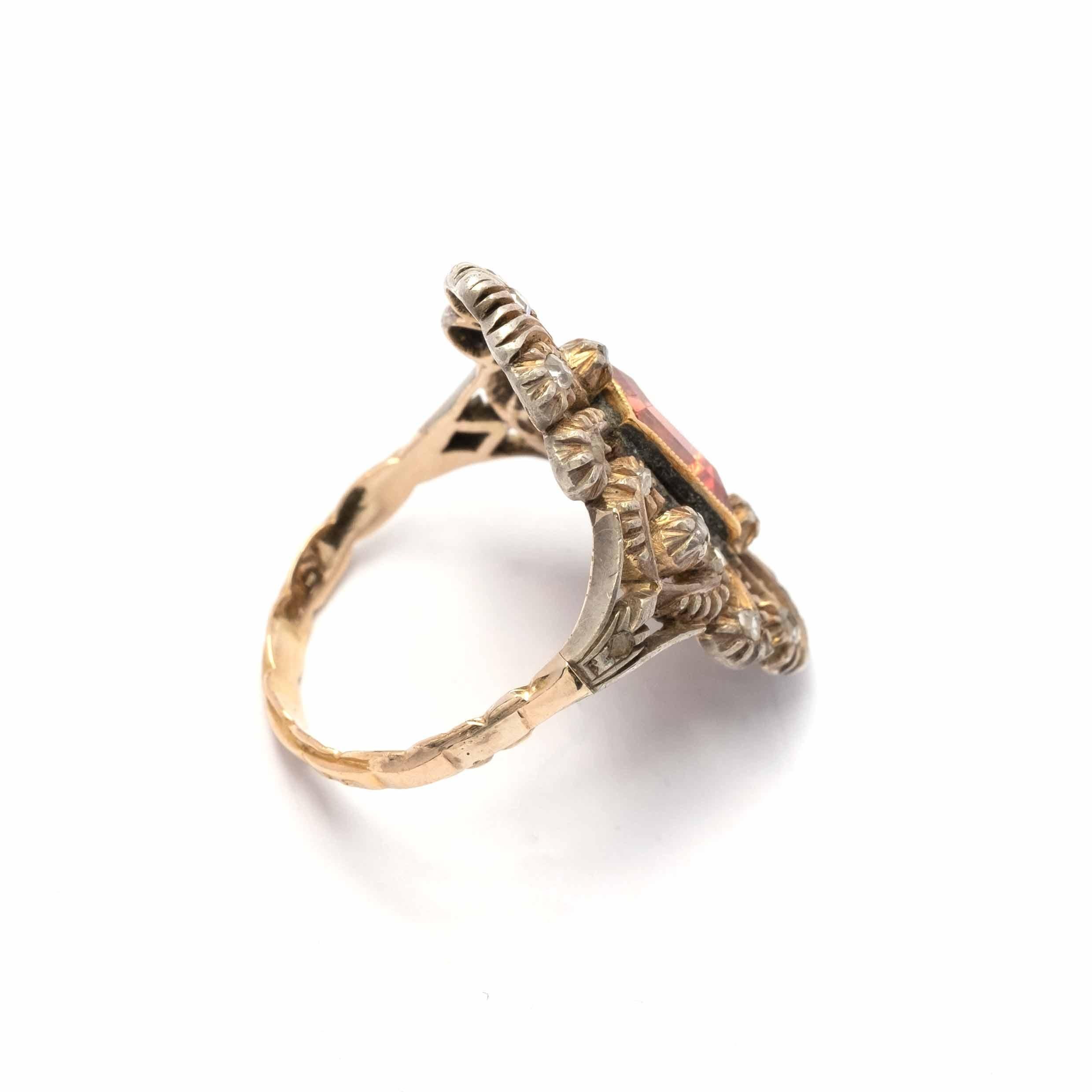 Vintage ring set in 18ct gold and silver, with rose cut diamonds and citrine quartz.

Highlights:
- 18ct gold and silver
- Rose cut diamonds
- Citrine quartz

Measurements
- Length 2.6 cm x width 1.9 cm
- Weight 4g
- Italian ring size 12.5 (can be