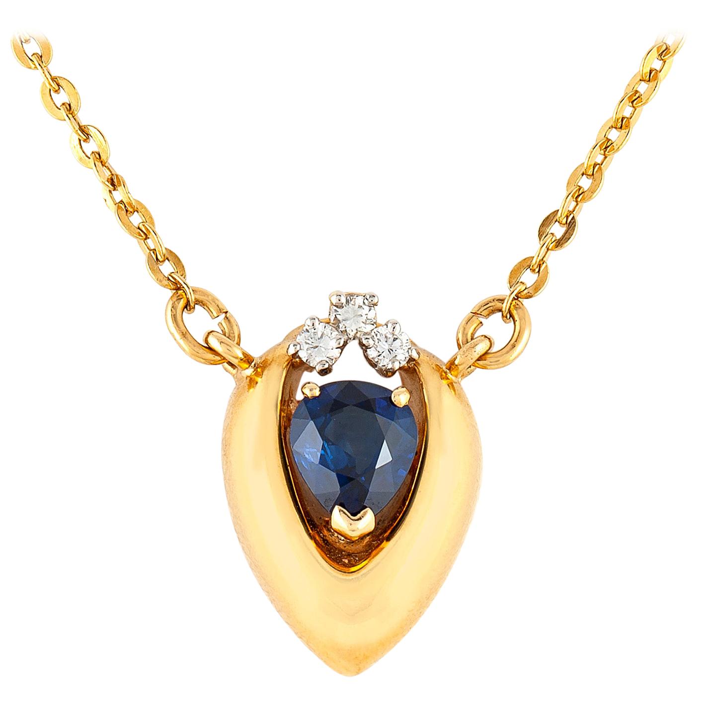 Marquise Gold Setting with Center Sapphire and Small Diamonds For Sale
