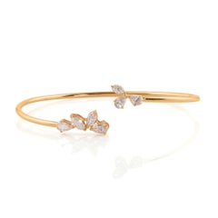 Bracelet manchette jonc en or jaune 18 carats avec diamants taille marquise et poire