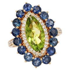 Marquise Peridot, Diamond and Sapphire Cluster Ring in 14 Karat Gold