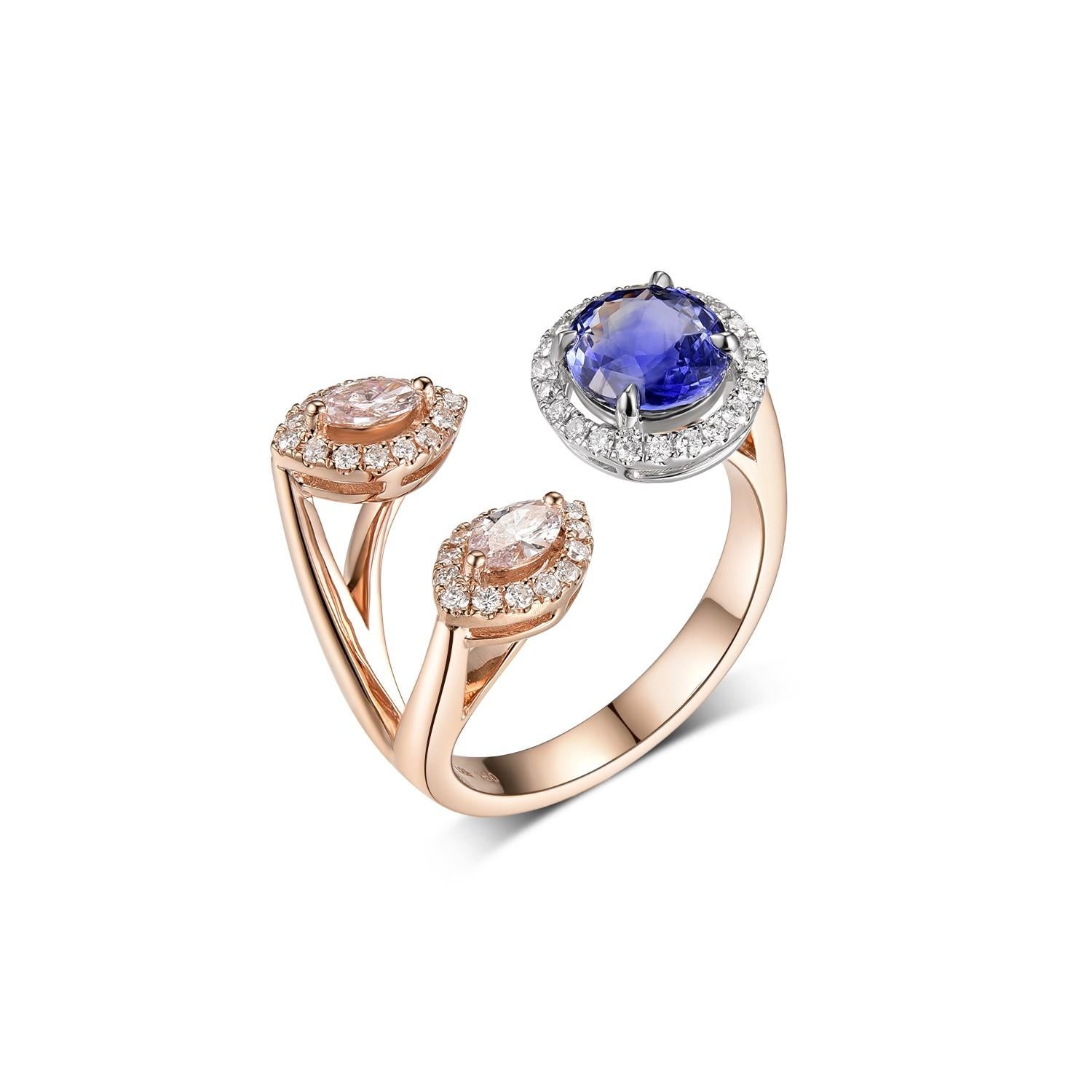 This ring features 2 marquise pink diamonds weight 0.24 carat each, 1.37 carat of blue sapphire and 0.26 carat of round diamond set in a bypass design. Diamonds are set in 18 karat white gold and the body of the ring is made with 18 karat rose gold.