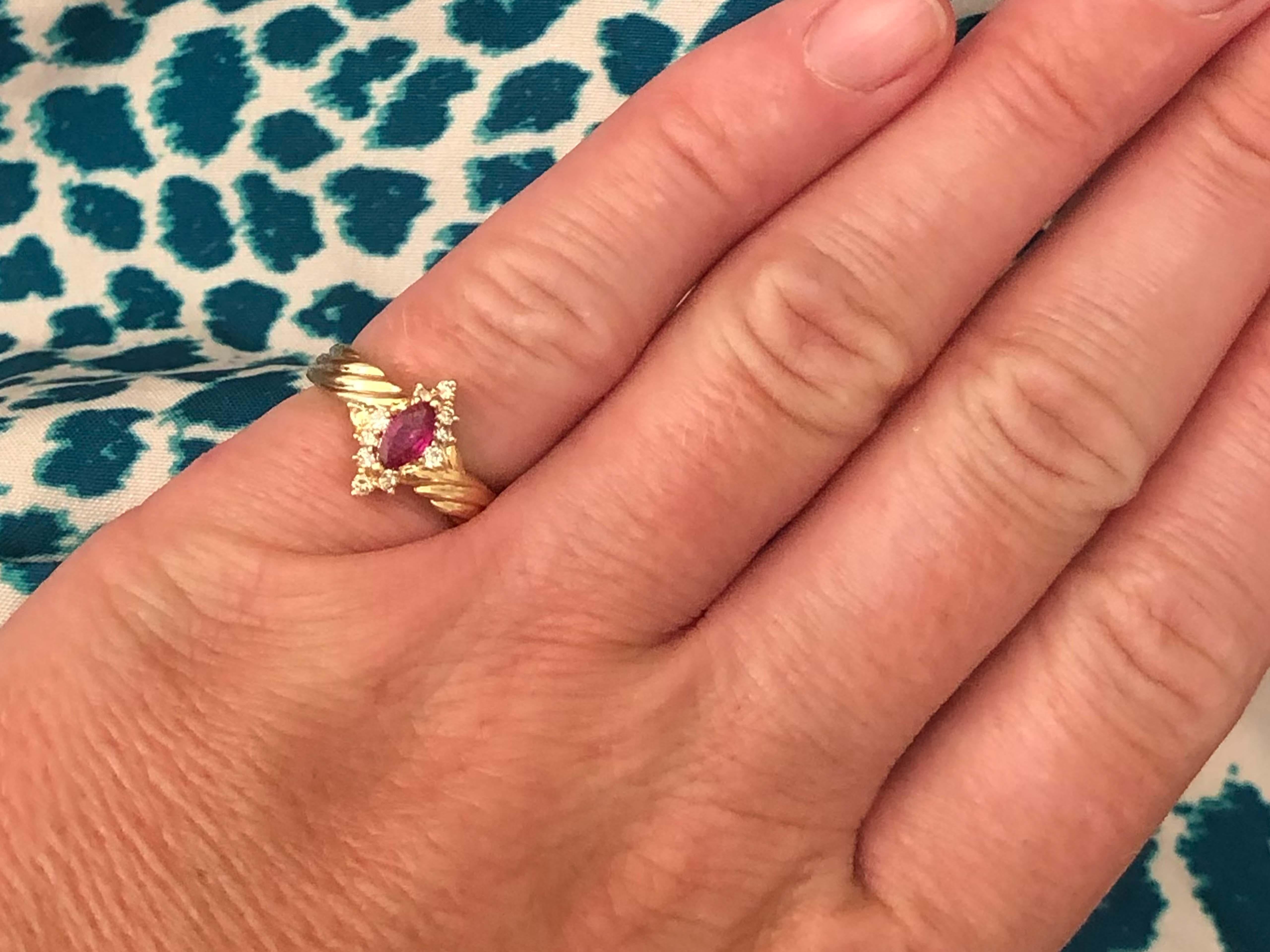 Item Specifications:

Metal: 14K Yellow Gold

Total Weight: 2.7 Grams

Ring Size: 4.5

Gemstone Specifications:

Gemstones: 1 marquise red ruby

Ruby Carat Weight: ~ 0.16 carats
​
​Ruby Measurements: 5.7 mm x 3.2 mm x 1.4 mm

Diamond Carat Weight: