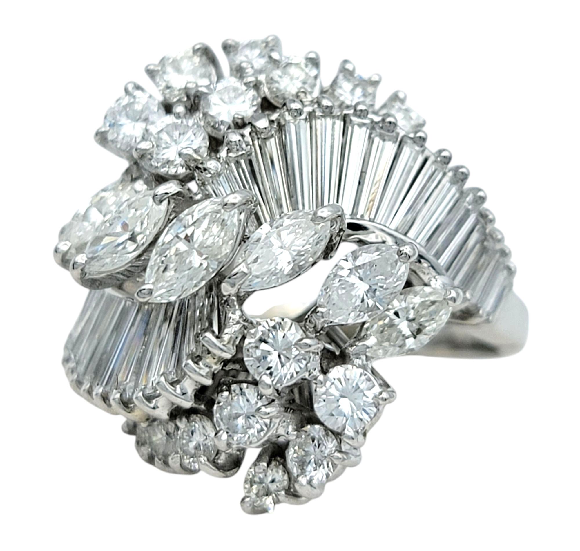 Ring Size: 5

Elevate your jewelry collection with this extraordinary multi-shape diamond ring, a dazzling statement of elegance and brilliance. Designed in 18 karat white gold, this stunning piece showcases a striking arrangement of marquise,