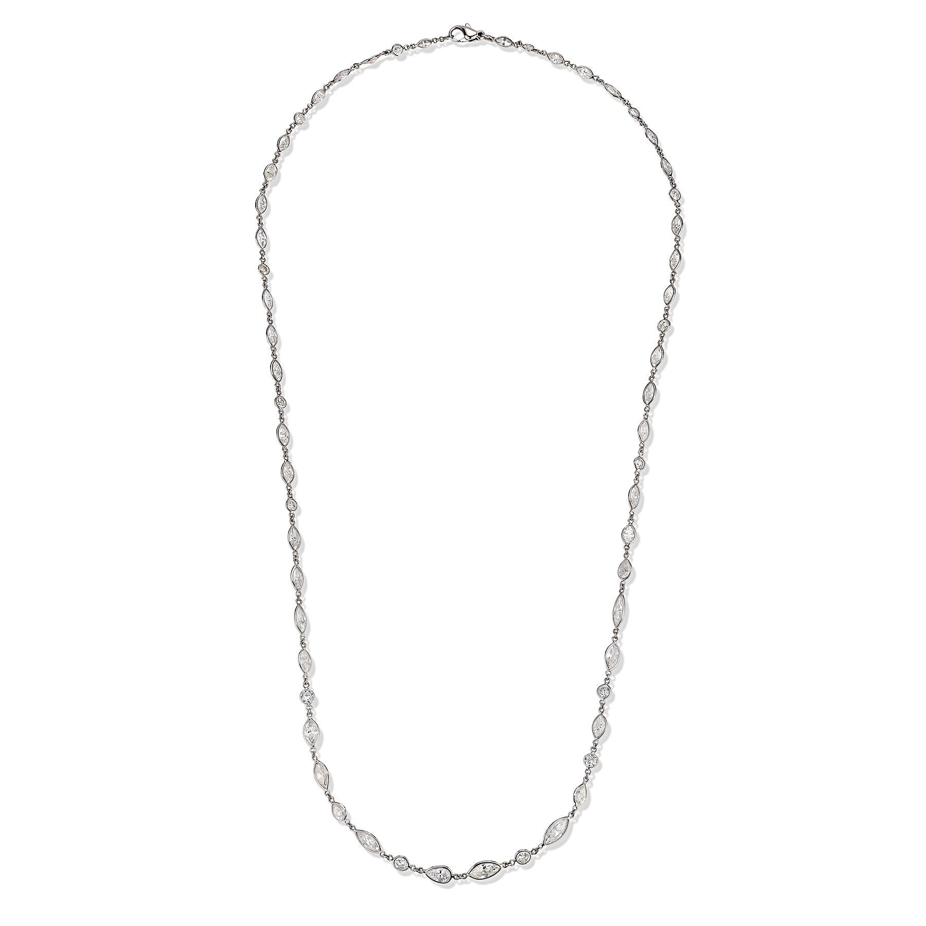 Collana a catena lunga con diamanti taglio marquise e rotondo

Diamanti taglio marquise e rotondi collegati tra loro a formare una lunga collana.

Peso totale dei diamanti: 22,60 carati 

Misure: 27.5