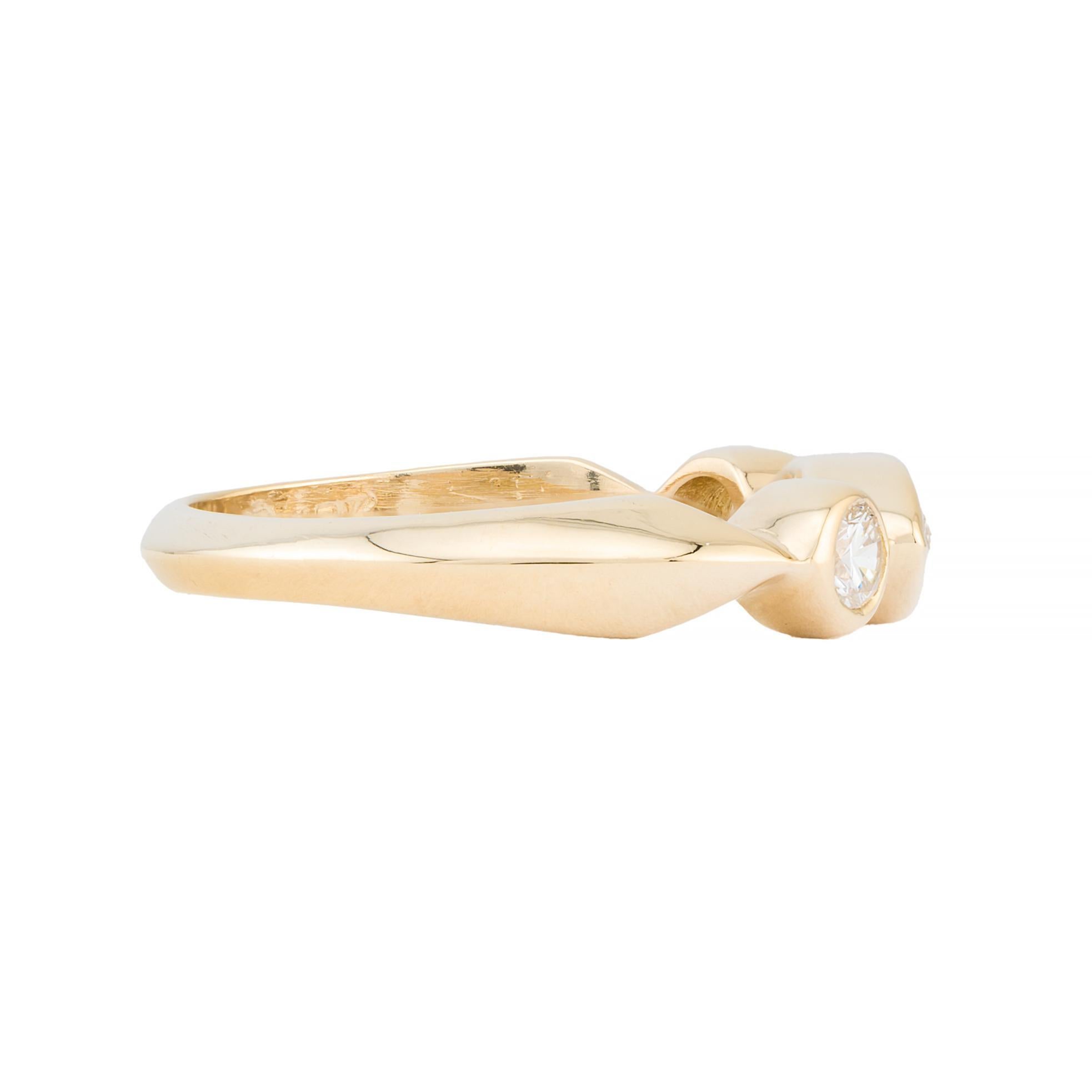 Aston Estate Jewelry Presents:

An elegant wedding ring featuring a 0.35 carat marquise cut diamond. Flanked by two 0.2 carat brilliant cut diamonds. All diamonds are of VS1 clarity and G color grade.

Crafted in 18k yellow gold, showcasing refined