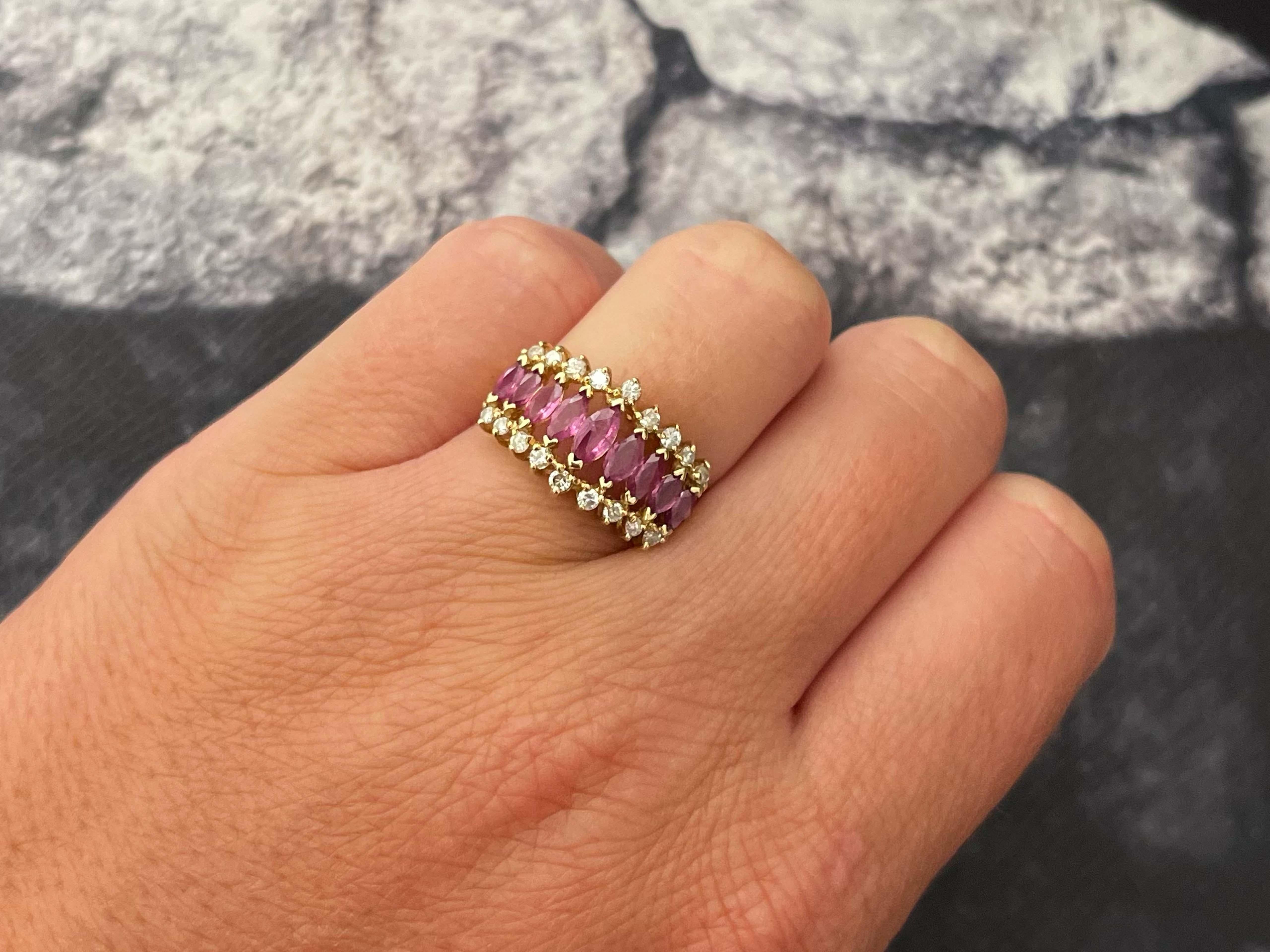 Item Specifications:

Metal: 14K Yellow Gold

Style: Statement Ring

Ring Size: 5.5 (resizing available for a fee)

Total Weight: 4.1 Grams

Gemstone Specifications:

Gemstones: 9 red rubies

Ruby Carat Weight: 1 carat

Diamond Carat Weight: 0.25