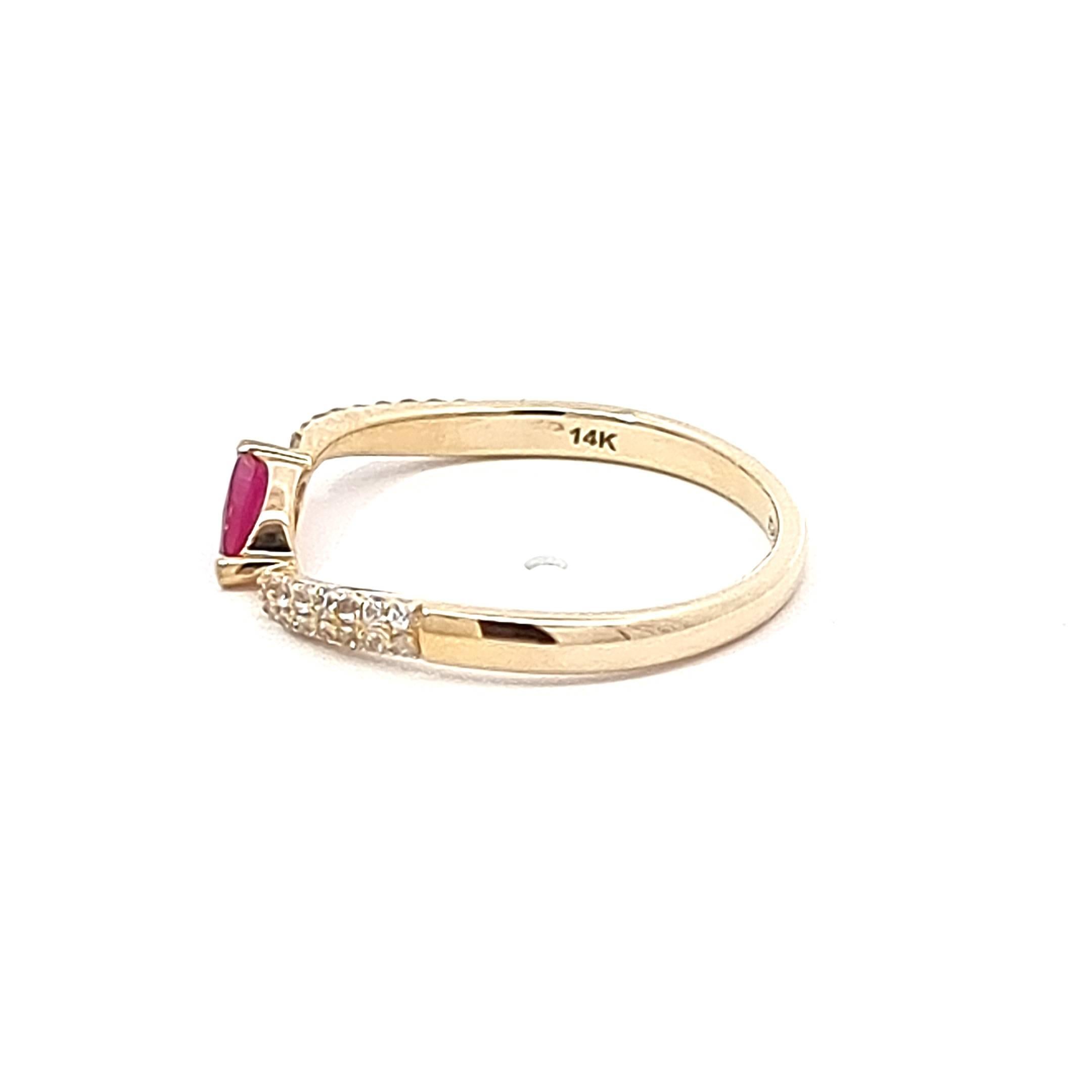 Enchant in the radiance of our 14K Yellow Gold Ring, featuring a captivating marquise Mozambique ruby at its heart, exuding a warm and passionate glow. The marquise-cut ruby, a rich 0.21-carat gem, is cradled amidst the brilliance of white sapphires