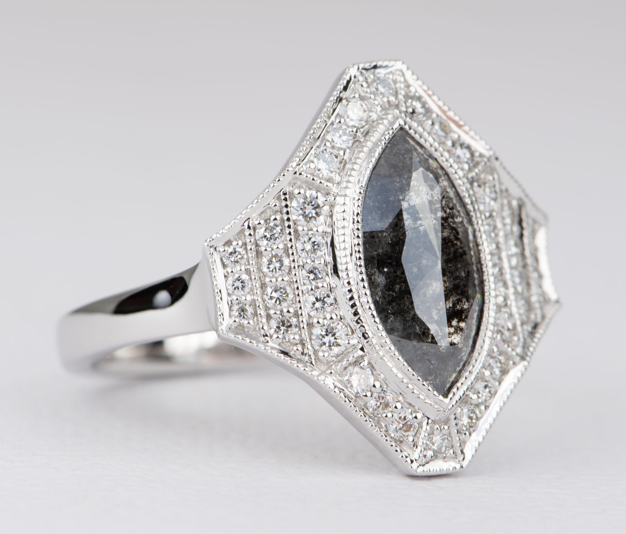 ♥  Solid 14K white gold ring set with a gorgeous marquise diamond in the center, flanked by several rows of white sparkly diamonds in a halo style and on the shank.
♥  The entire ring setting is decorated with hand-applied milgrain for a