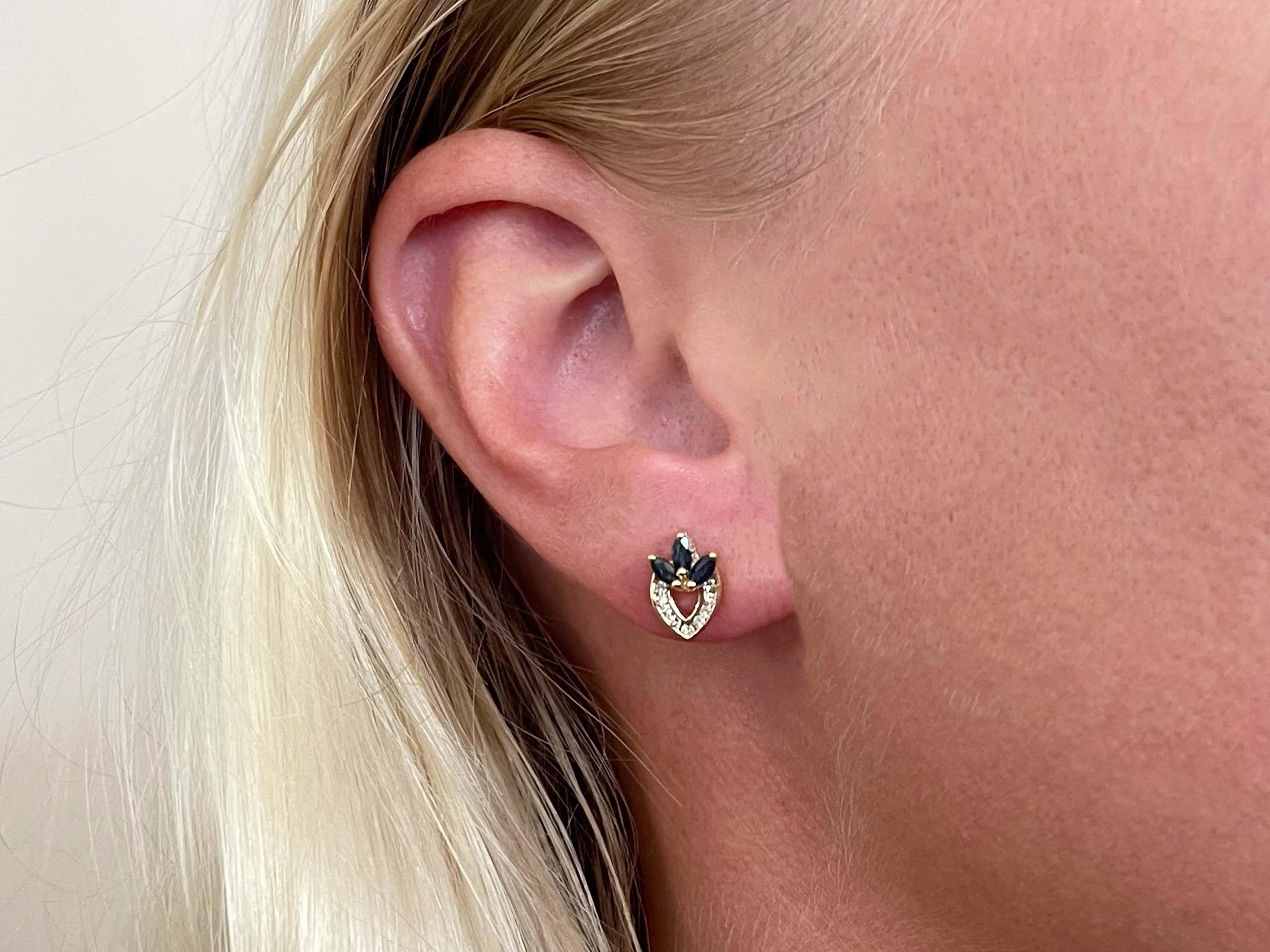 Earrings Specifications:

Metal: 14K Yellow Gold

Total Weight: 2.0 Grams

Gemstone: 6 Sapphires
​
​Sapphire Carat Weight: 0.20 carats

Diamond Color: G
​
​Diamond Count: 18  
​
​Diamond Clarity: SI1-SI2 
​
​Diamond Carat Weight:  0.10
Condition: