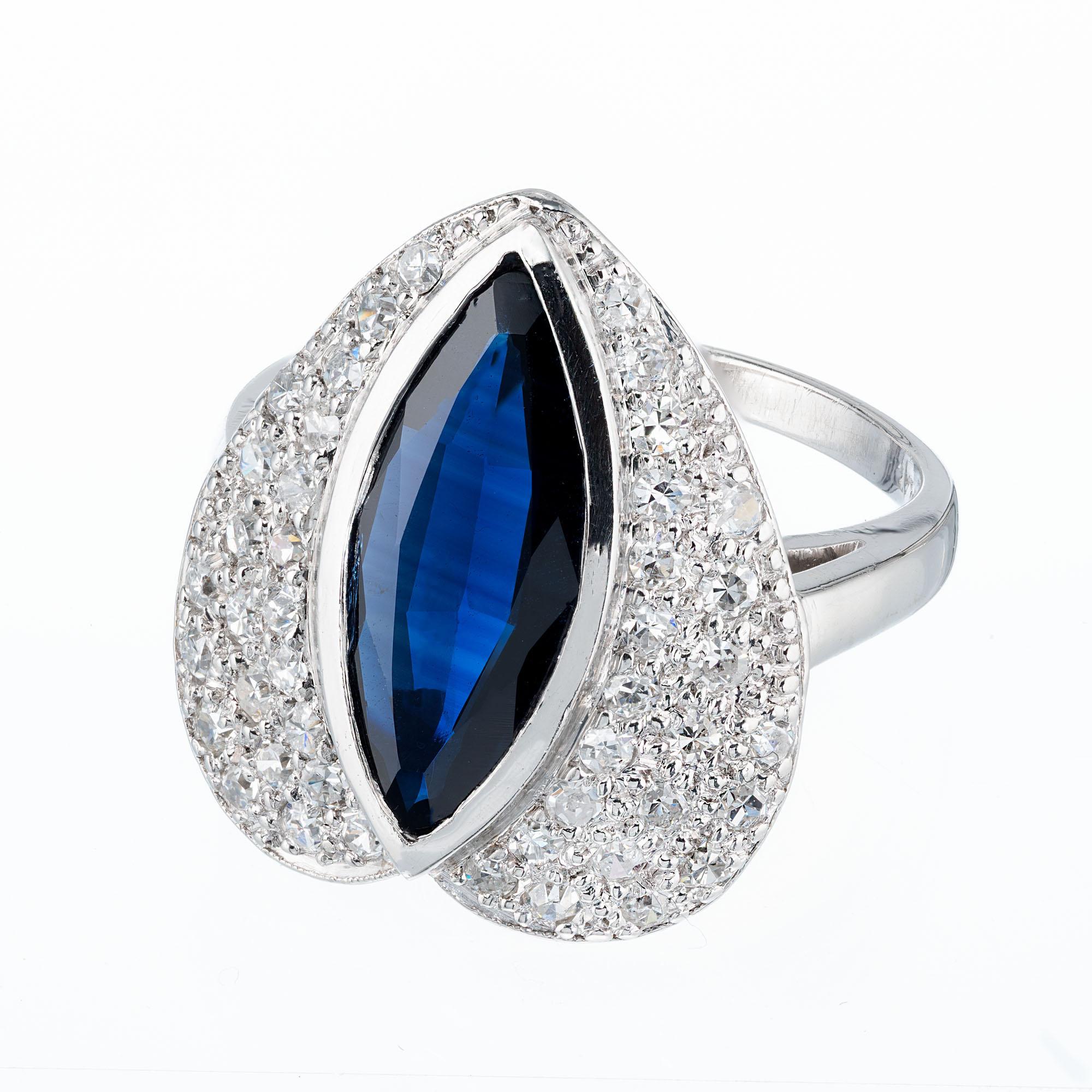 Heart shaped ring set with a royal blue Marquise shaped Sapphire in the heart shaped diamond top. Circa 1960-1970.

1 Royal blue Sapphire 15 x 6mm Marquise, approx. total weight 2.50cts
44 single cut diamonds approx. total weight .65cts, G,