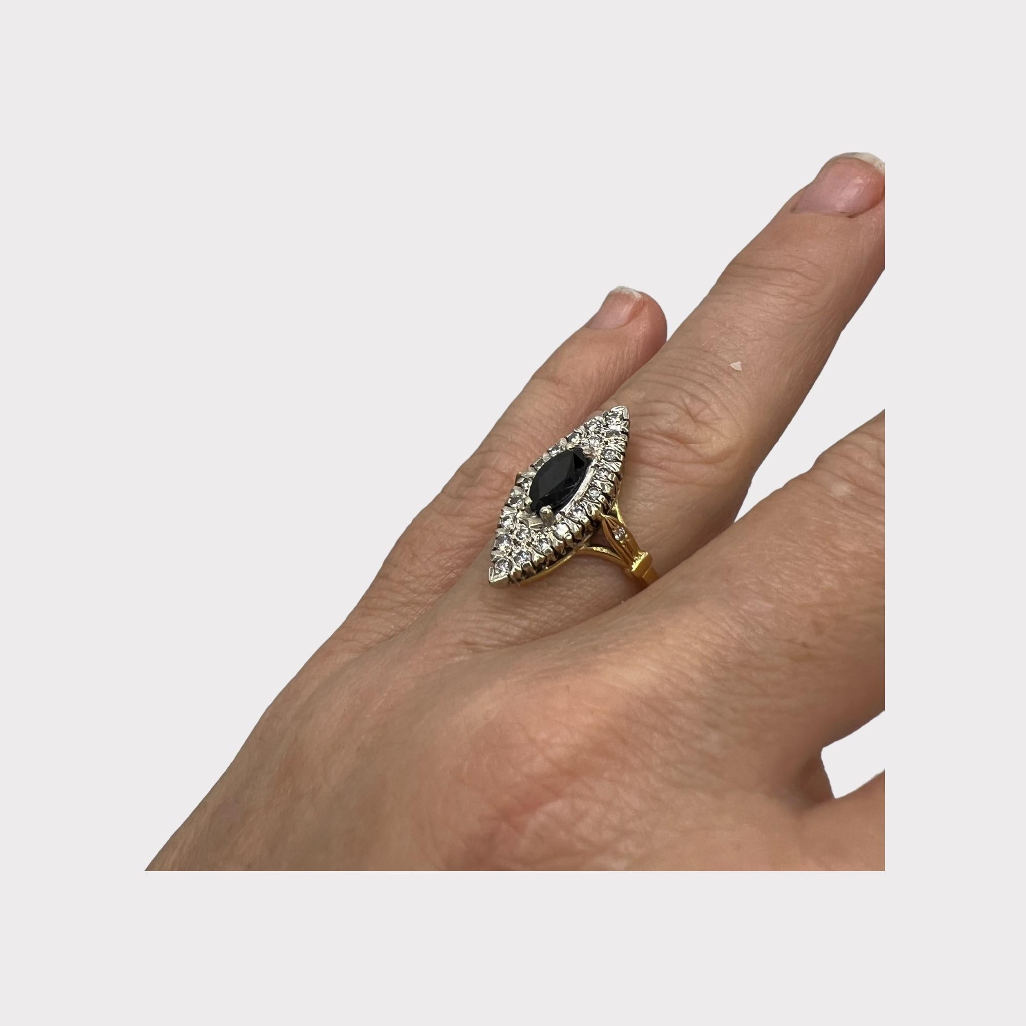 Elegant and timeless, this beautiful marquise-shaped ring from the early 20th century captures the charm and craftsmanship of antique French jewelry.

At its center is a captivating 1-carat blue sapphire, rich and luminous in tone, set in a finely