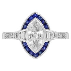 Anello in oro bianco con diamante taglio marquise e zaffiro blu a forma di aureola in stile Art Deco