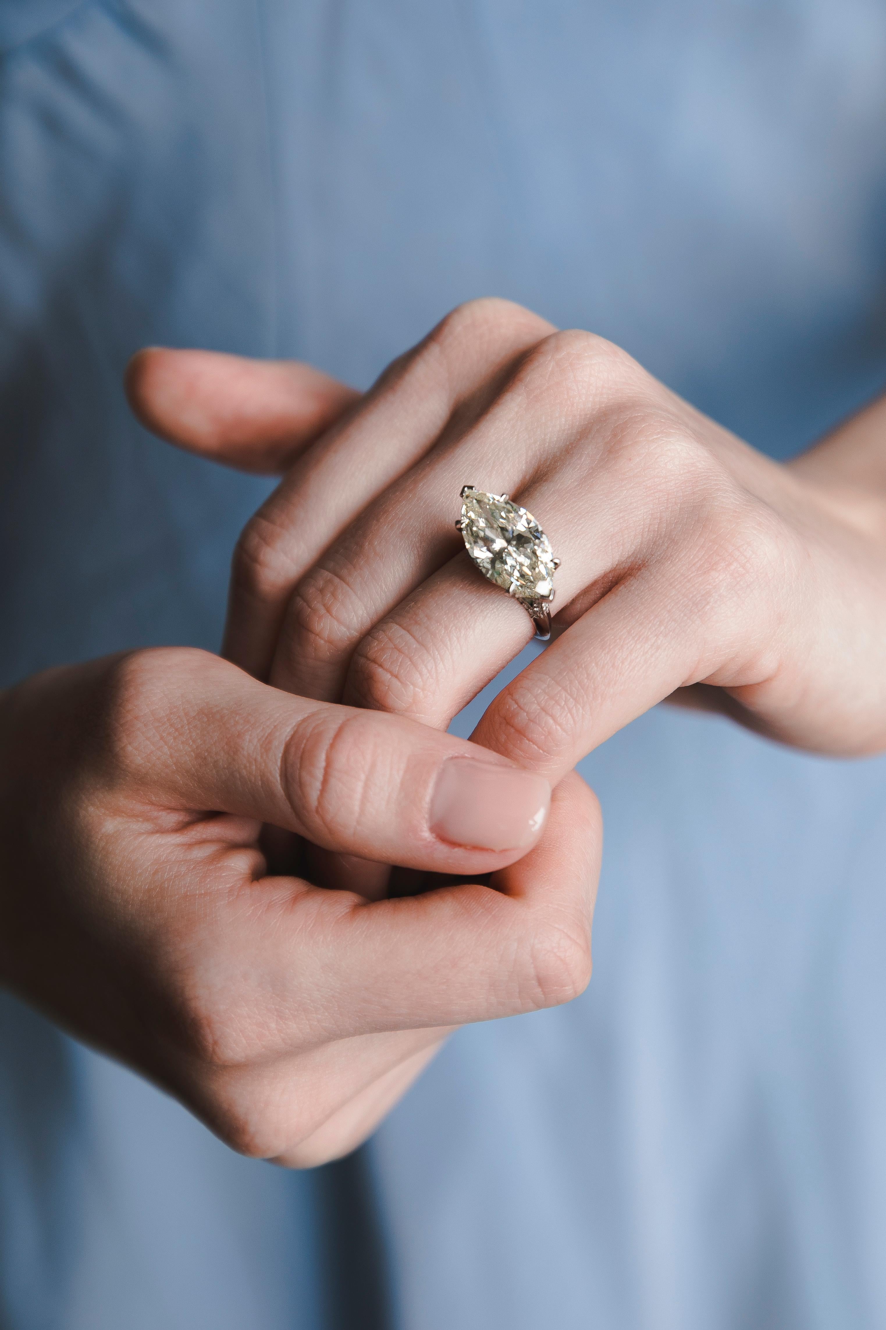 8.15 Carat Marquise Diamond with Emerald ring. Marvellous creation from the time when jewelers spared no time achieving the ultimate quality and beauty. The Diamond itself is so important and unusual that it needed a special setting. The ring