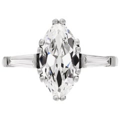 Marquise shape diamond flanked solitaire ring, circa 1950