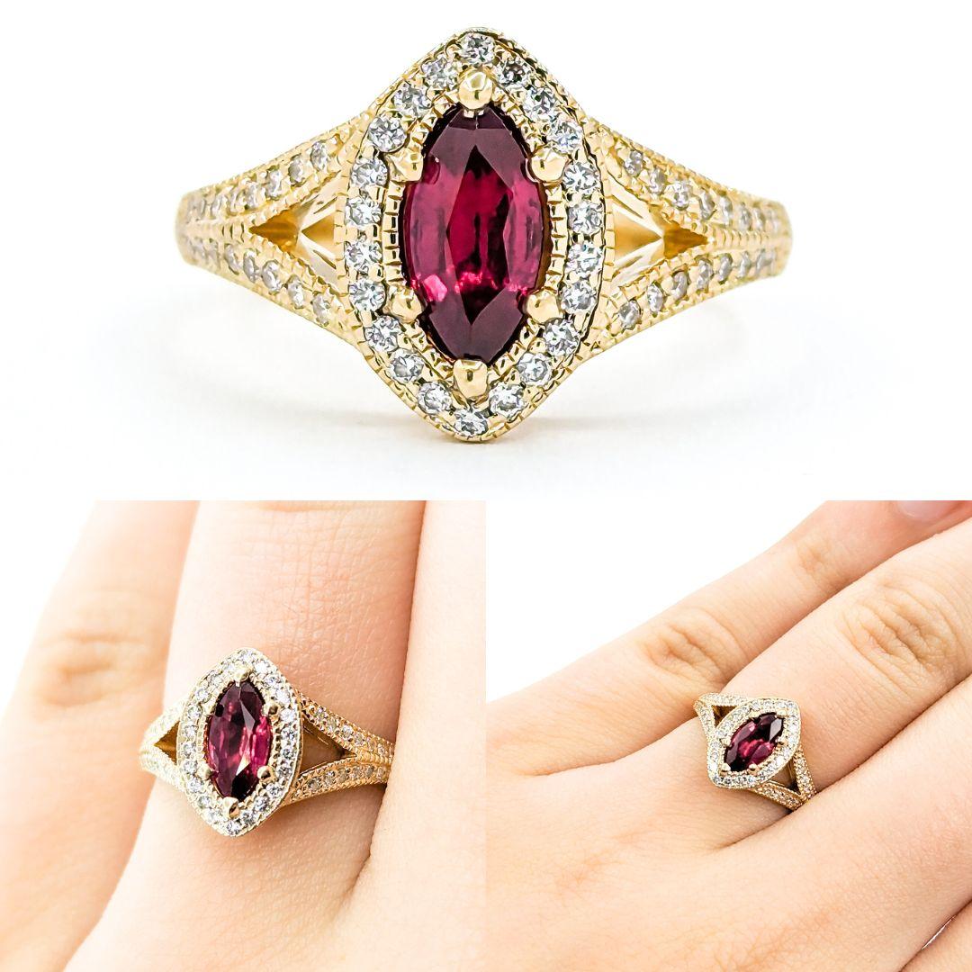 Marquise Shape Ruby & Diamond Halo Ring in Yellow Gold

Introducing this beautiful ring crafted in 14kt yellow gold. The ring features a marquise-shaped ruby centerpiece with .26ctw round diamonds in a halo setting. The diamonds are SI clarity and