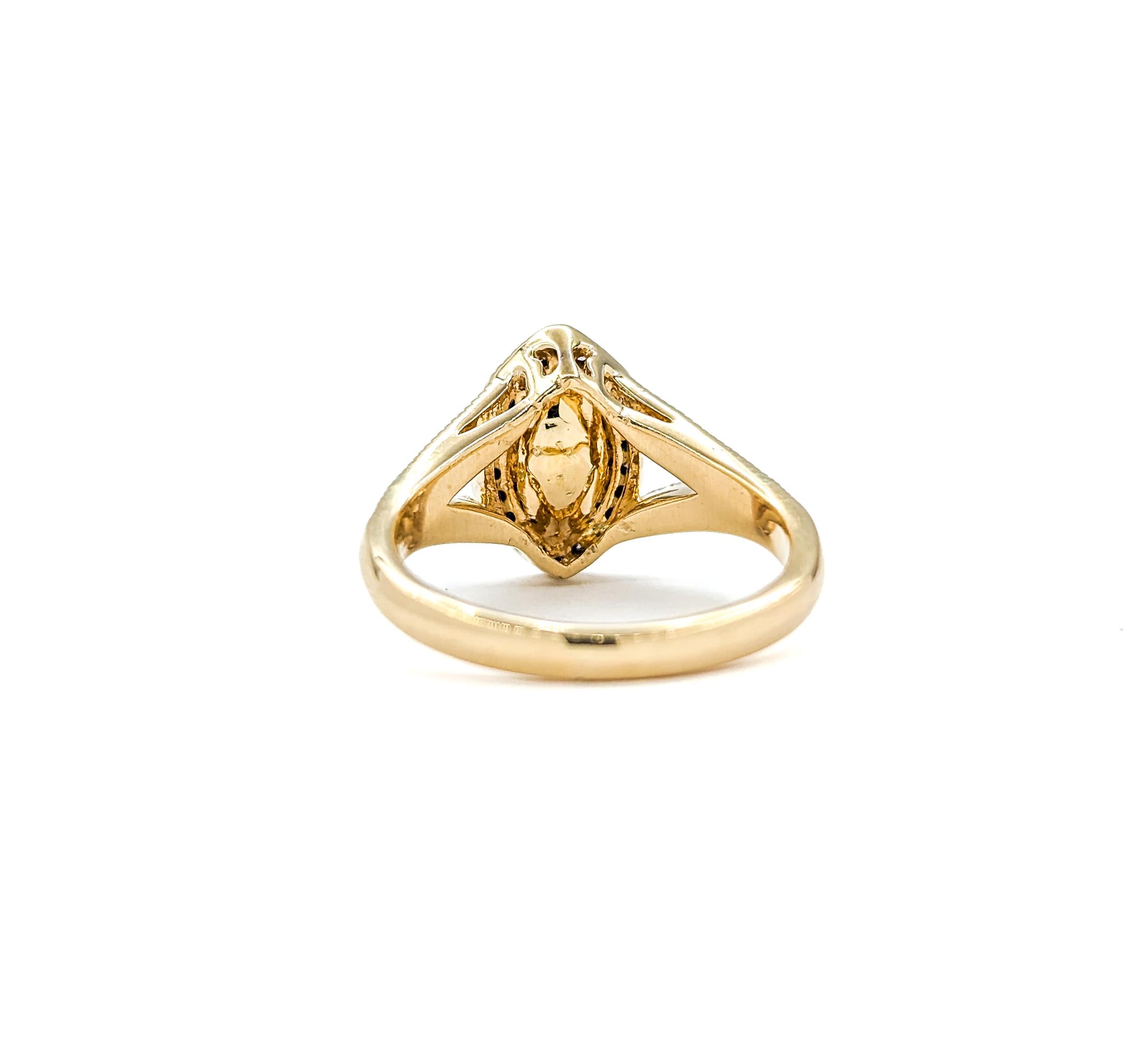 Women's Marquise Shape Ruby & Diamond Halo Ring in Yellow Gold