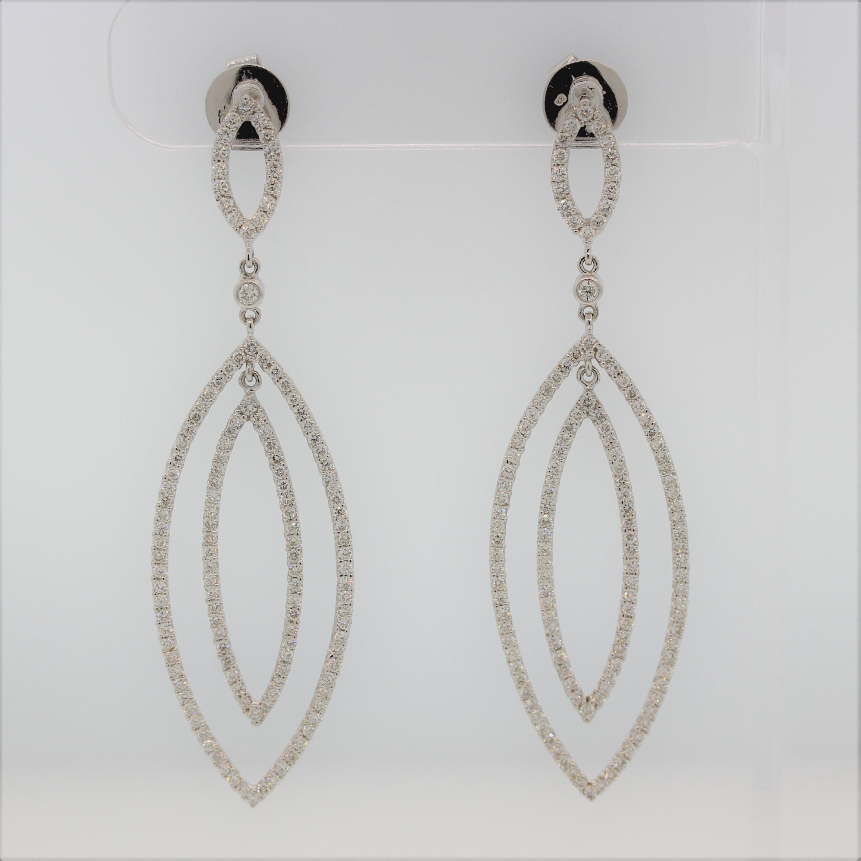 A wonderful pair of drop earrings! They feature 2.48 carats of round brilliant cut diamonds set in 3 marquise shaped gold fixtures, with 2 of them being drops. Made in 18k white gold, these long drop earrings will take any outfit to the next