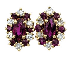 Marquise Shaped Ruby and Diamond Halo Stud Earrings in 14 Karat Yellow Gold