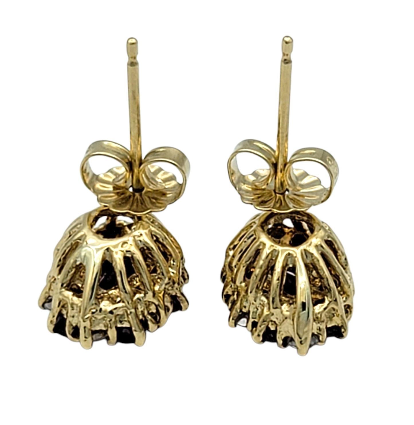 Women's Marquise Shaped Ruby and Diamond Halo Stud Earrings in 14 Karat Yellow Gold For Sale