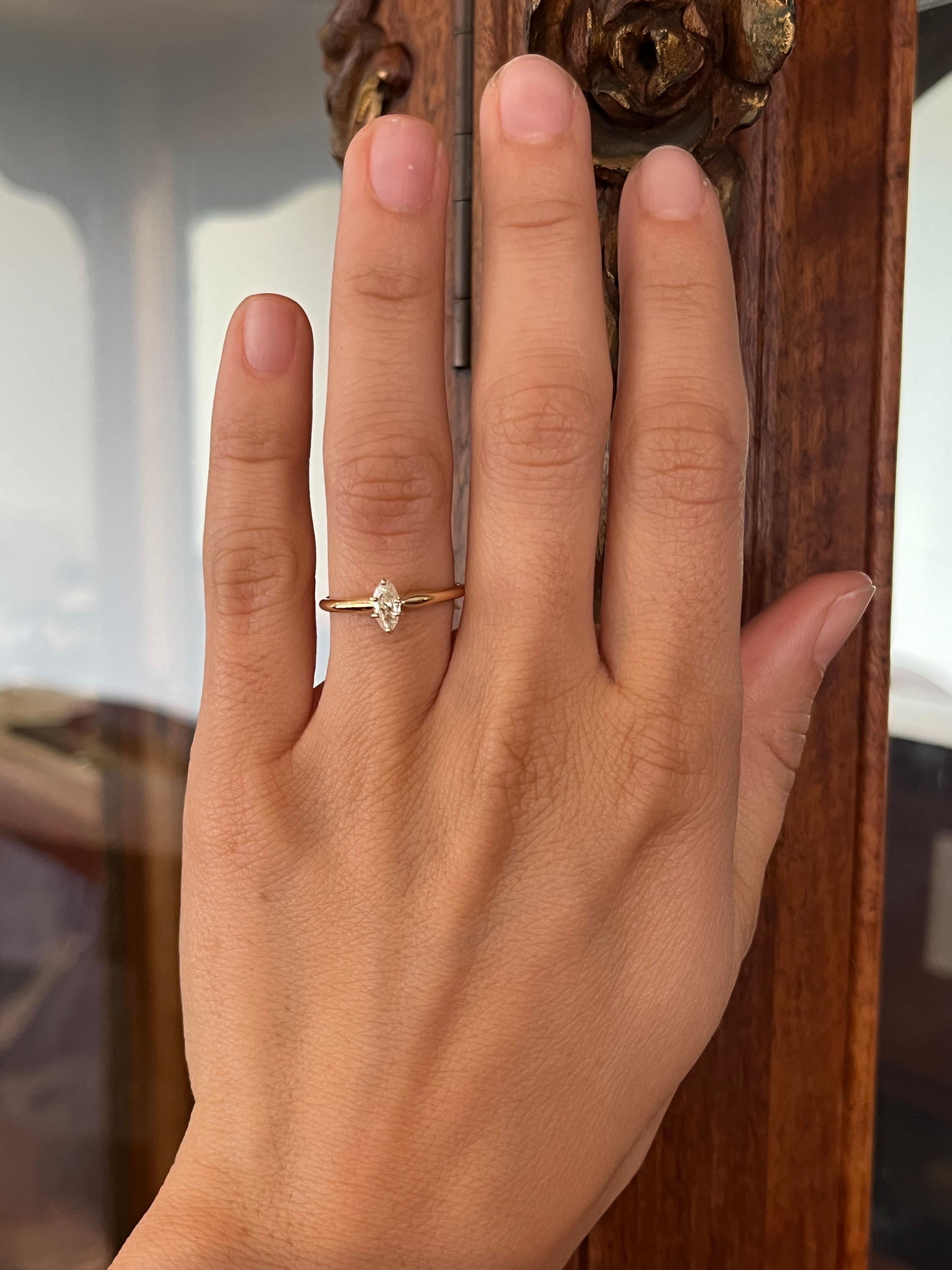 A delicate 0.23ct marquise cut diamond rests in a classic 14K yellow gold solitaire. Perfectly petite with unique charm. From our modern estate fine jewelry collection.

- 0.23ct marquise cut natural diamond, I1 clarity, J-K color
- Metal: 14K