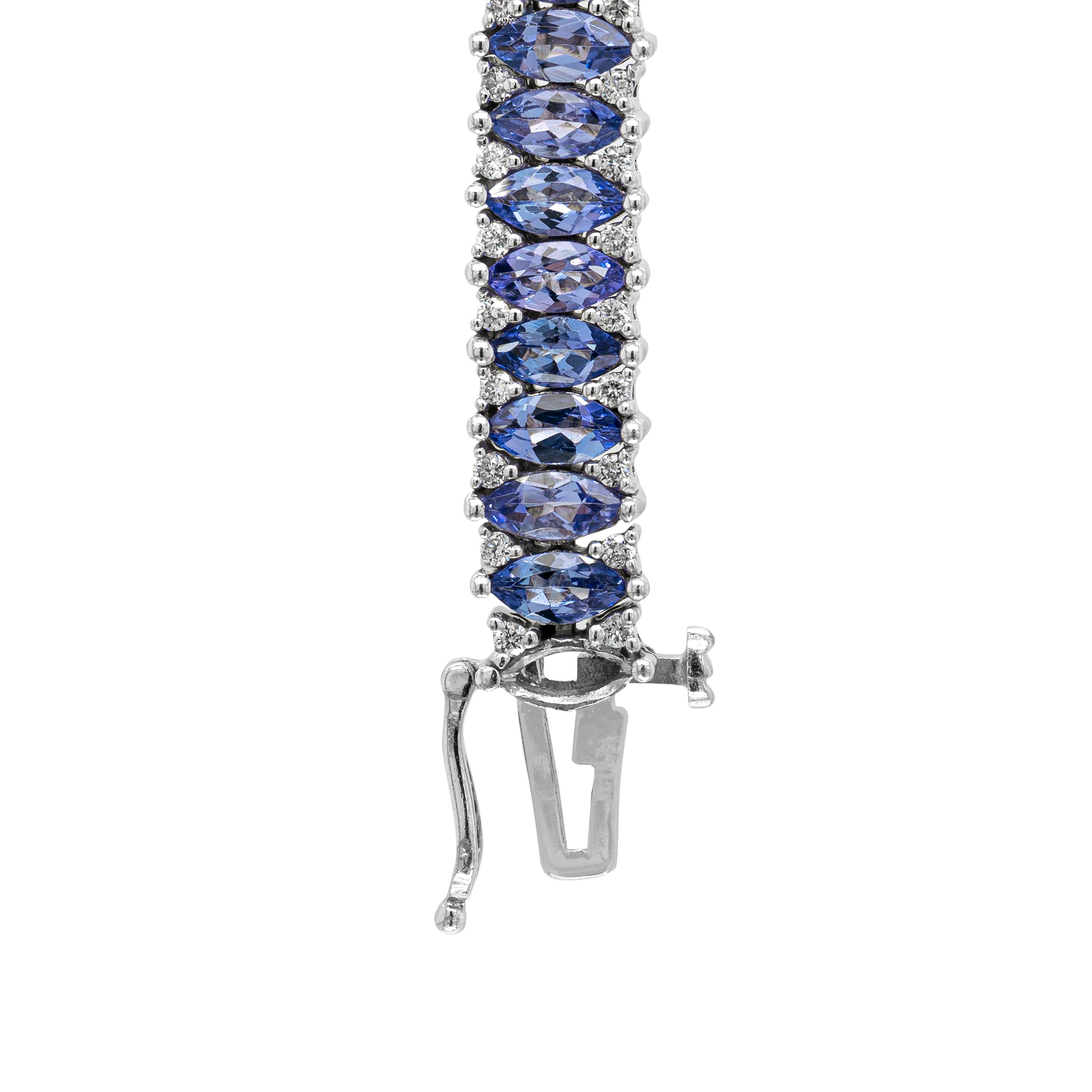 This stunning 18 carat white gold line bracelet is beautifully set with approximately 10.00 carats of marquise shaped tanzanite gemstones. The gorgeous violet blue stones are complemented by small round brilliant cut diamonds claw set between,