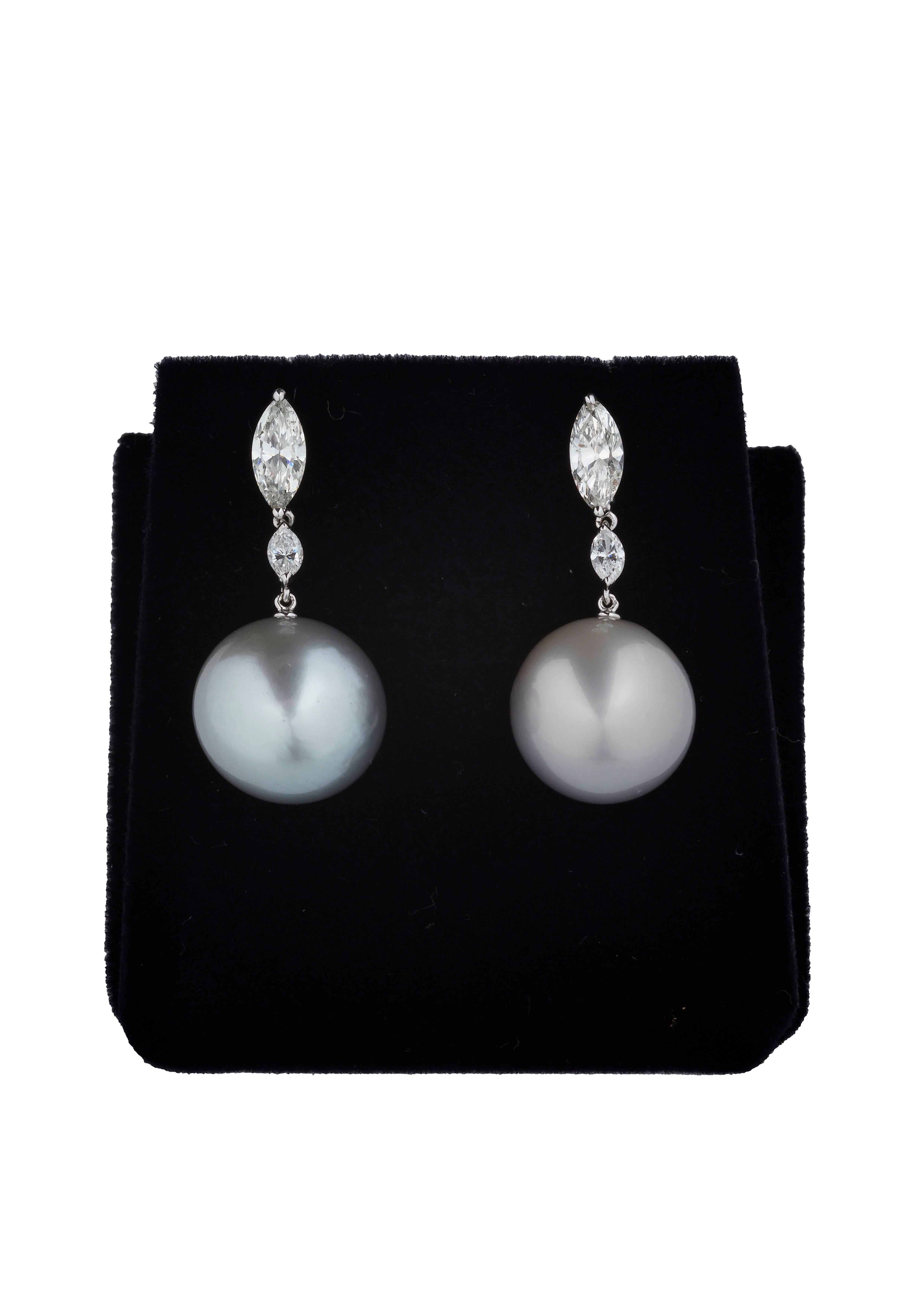 These exquisitely crafted earrings are classic and elegant and made of two drops of diamond mounted in 18k white gold supporting a single Australian pearl whose perfectly round shape and sophisticated shade make this piece a timeless accent in any