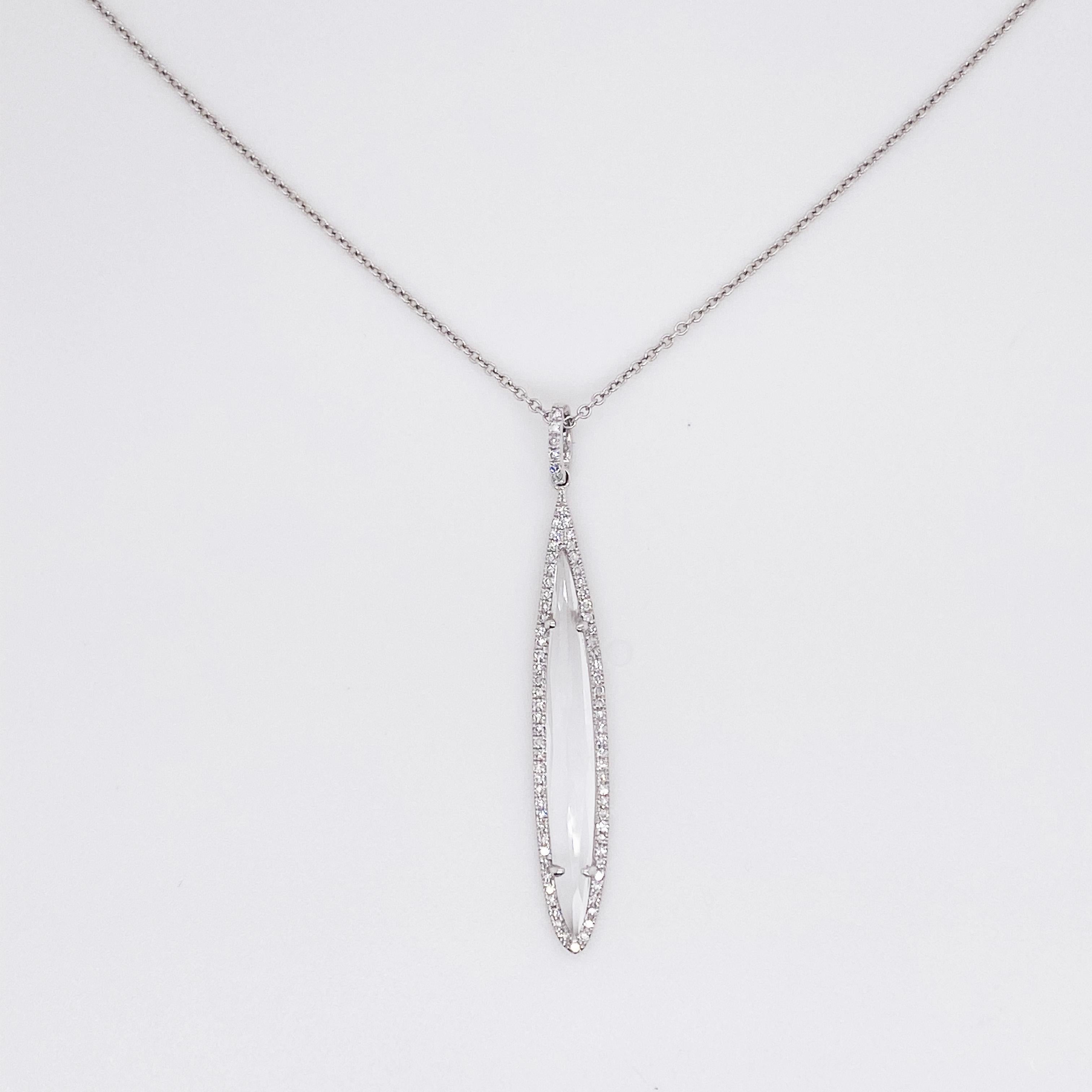 This striking marquise pendant has a single marquise white topaz in the center that is surrounded by diamonds and diamonds on the bail.  The pendant is hanging from a lovely 18 inch cable chain that has a secure lobster clasp.  The pendant has a