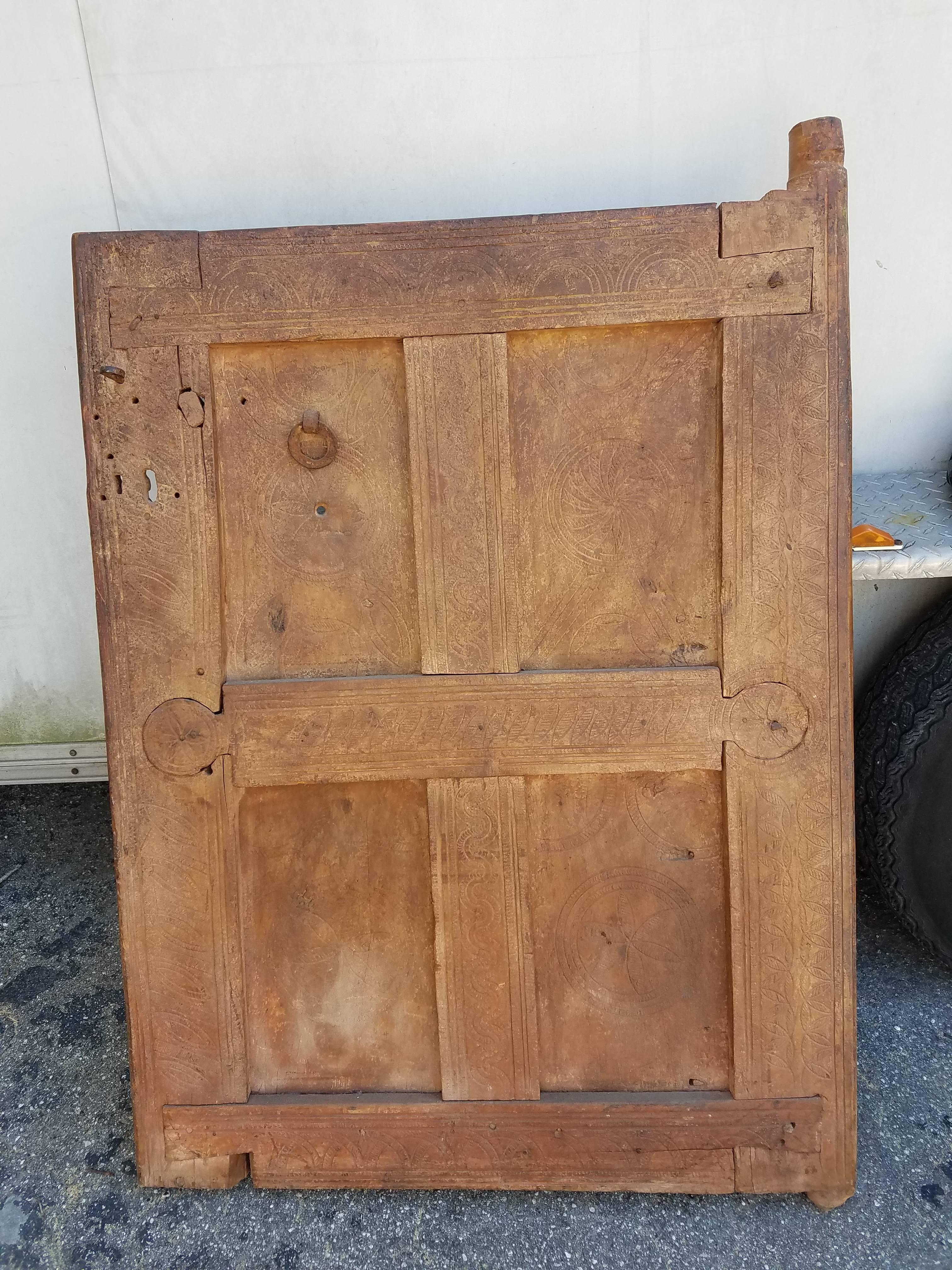 Very old and traditional Moroccan door or shutter. This door was taken from an old home in the Marrakech medina when the house was being destroyed. Great as a decorative door laying or hanging on a wall and very easy to install if used as a